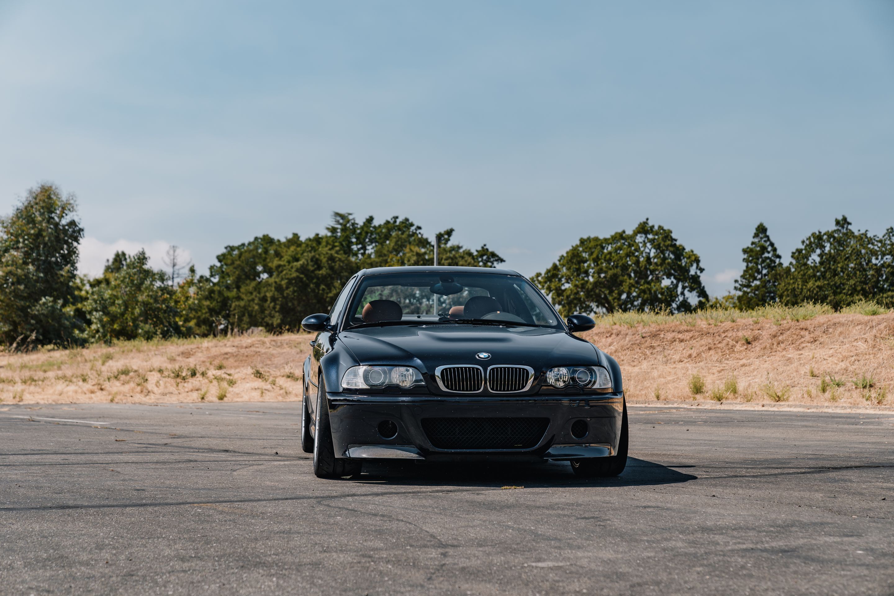 Black BMW E46 M3 with 18" ARC-8 Apex wheels in Hyper Silver