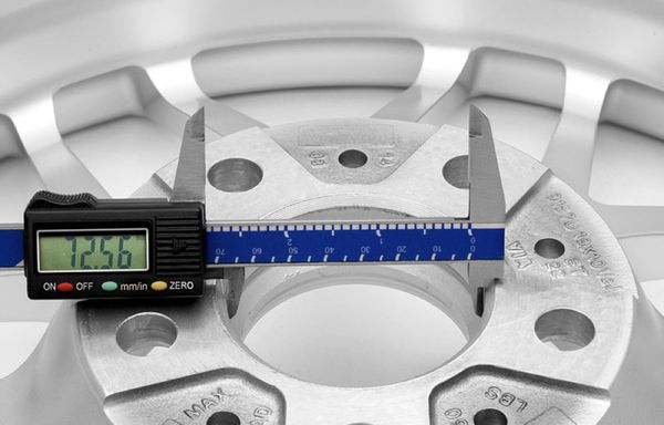 Digital caliper measuring inner hub of APEX wheel