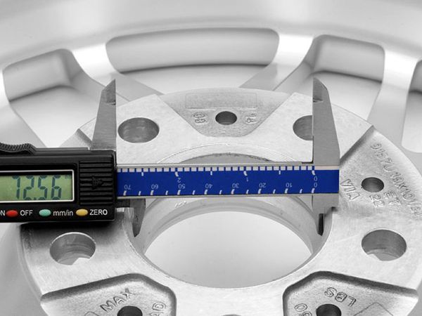 Digital caliper measuring inner hub of APEX wheel