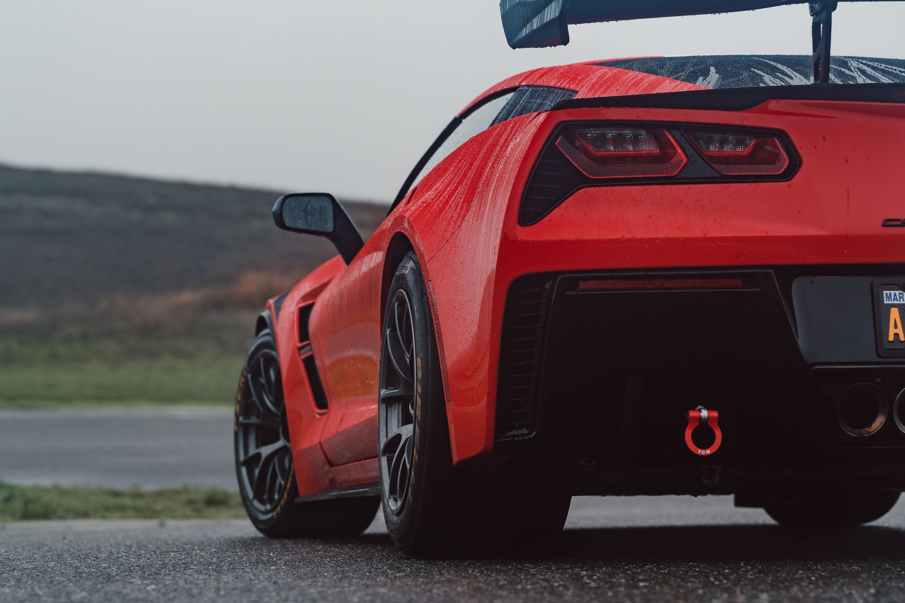 Red Chevrolet C7 Corvette Grand Sport with 18" VS-5RE Apex wheels in Anthracite
