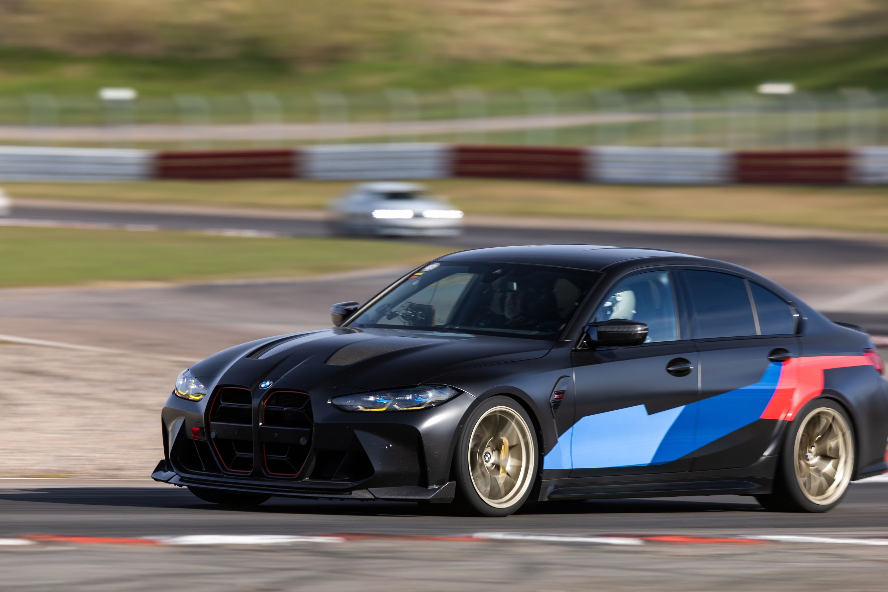 Black BMW G80 M3 with 19" VS-5RS Apex wheels in Motorsport Gold