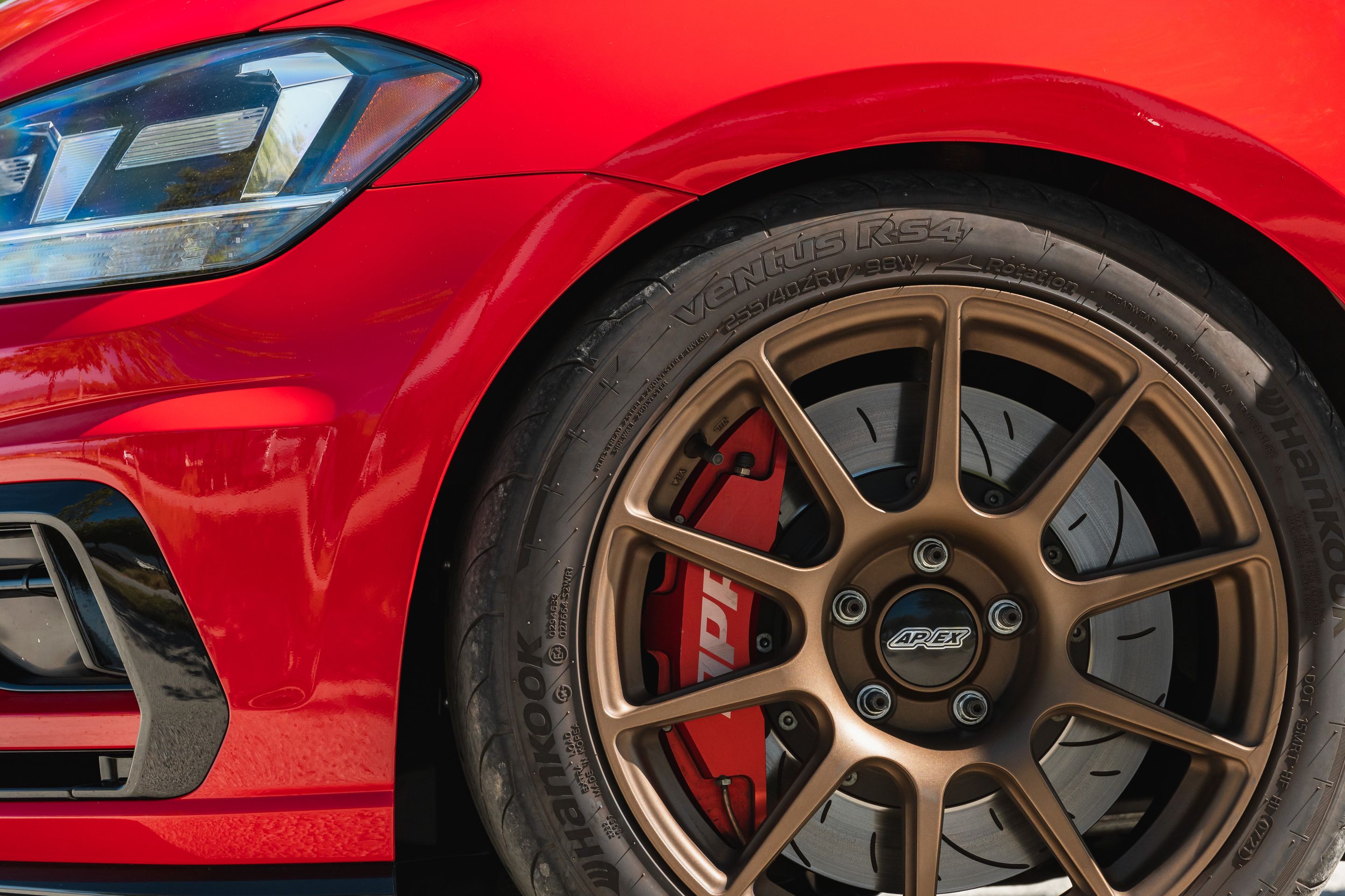 Red VW MK7 Alltrack/SportWagen Golf SportWagen with 17" SM-10 Apex wheels in Satin Bronze