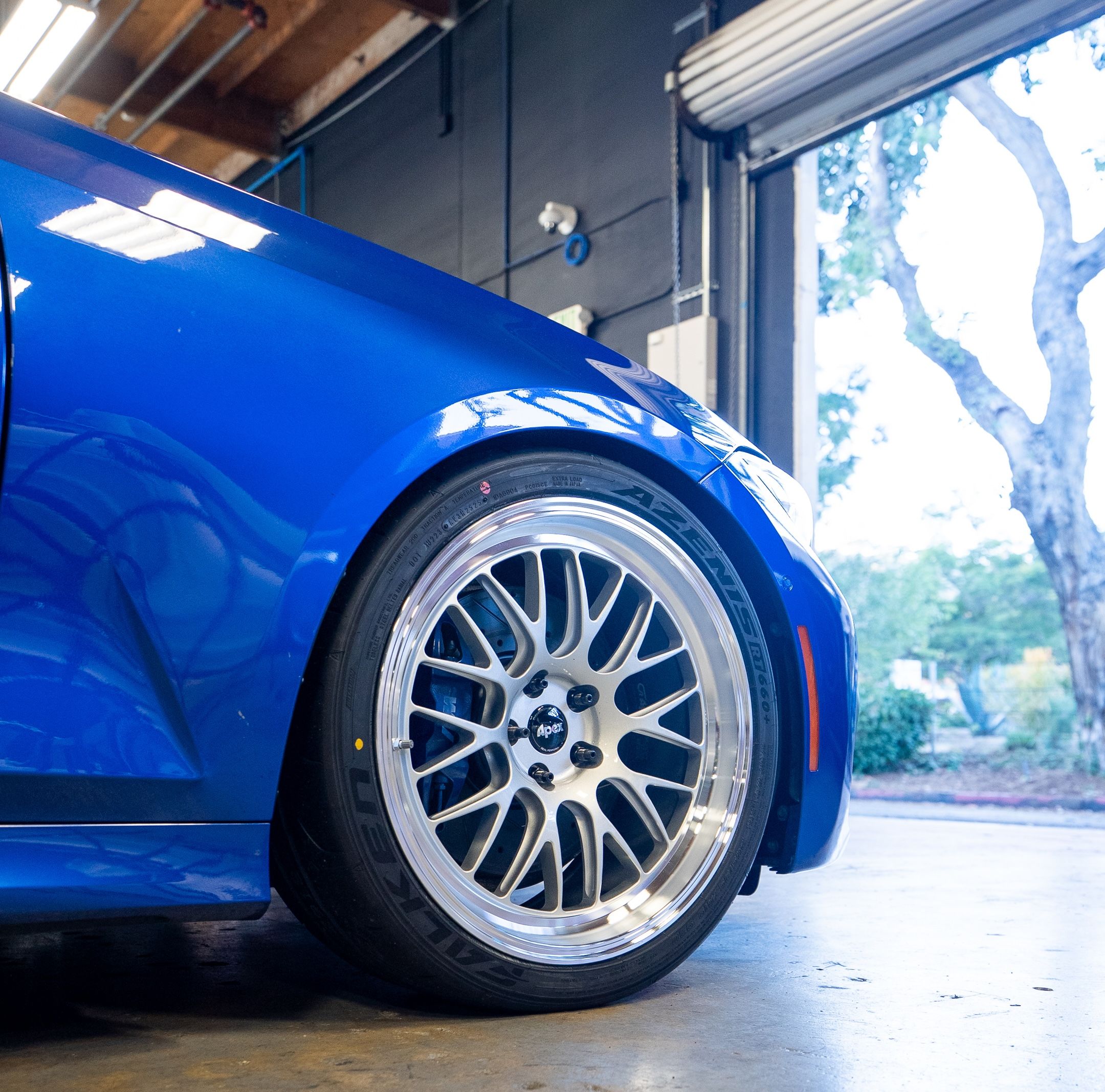 Blue BMW G20 Sedan 3 Series with 19" ML-10RT Apex wheels in Machined Lip Race Silver