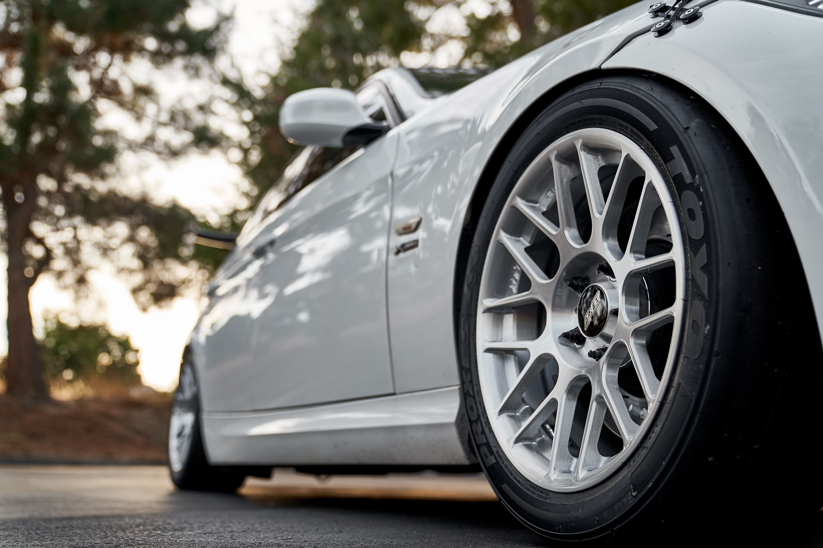 White BMW E90 LCI Sedan 3 Series with 17" ARC-8R Apex wheels in Brushed Clear