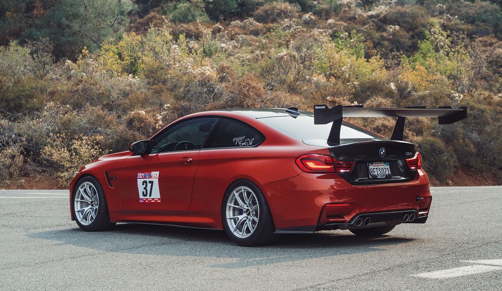 Orange BMW F82 Coupe M4 with 18" VS-5RS Apex wheels in Brushed Clear