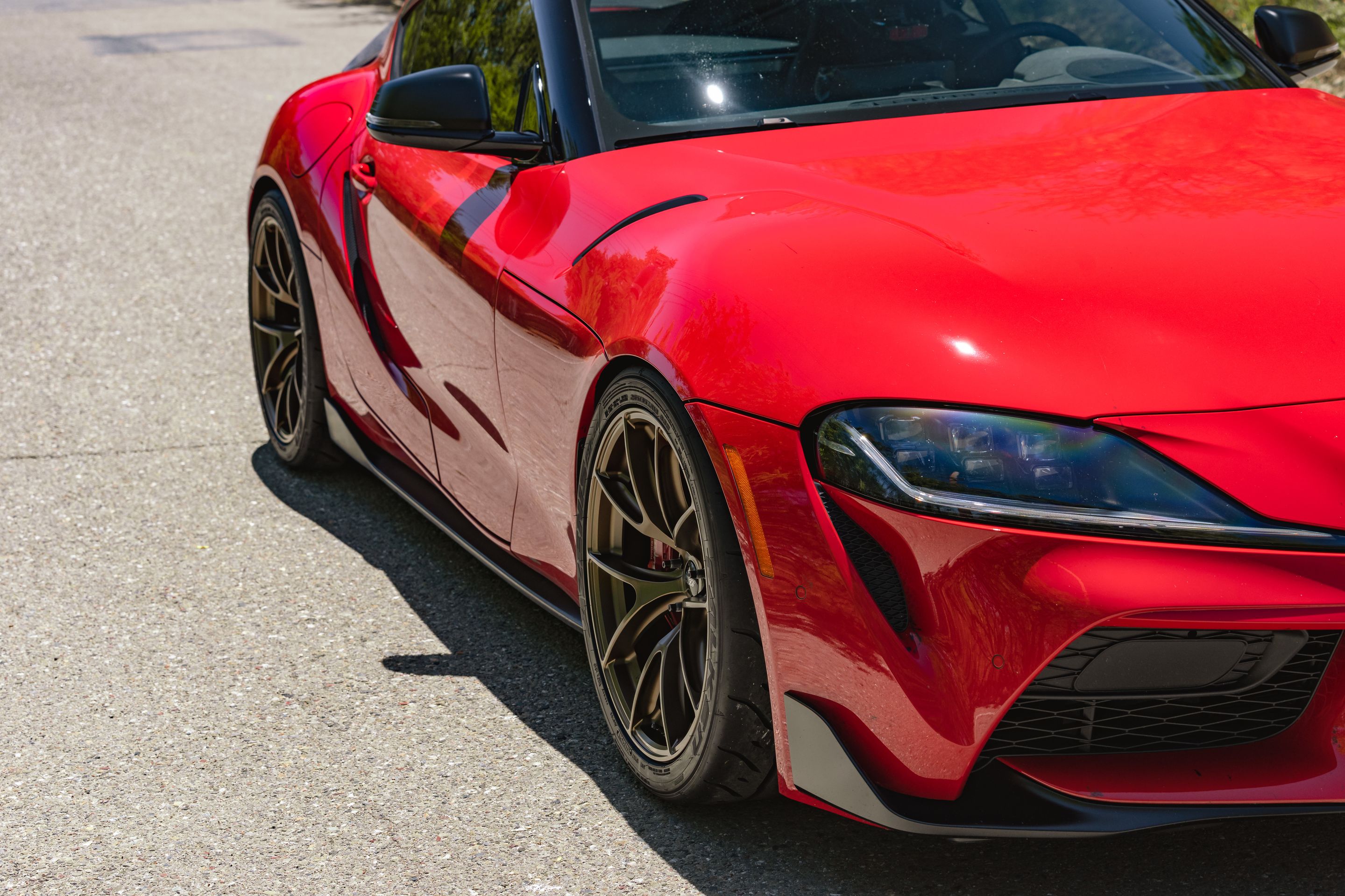 Red Toyota GR Supra with 19" VS-5RS Apex wheels in Satin Bronze