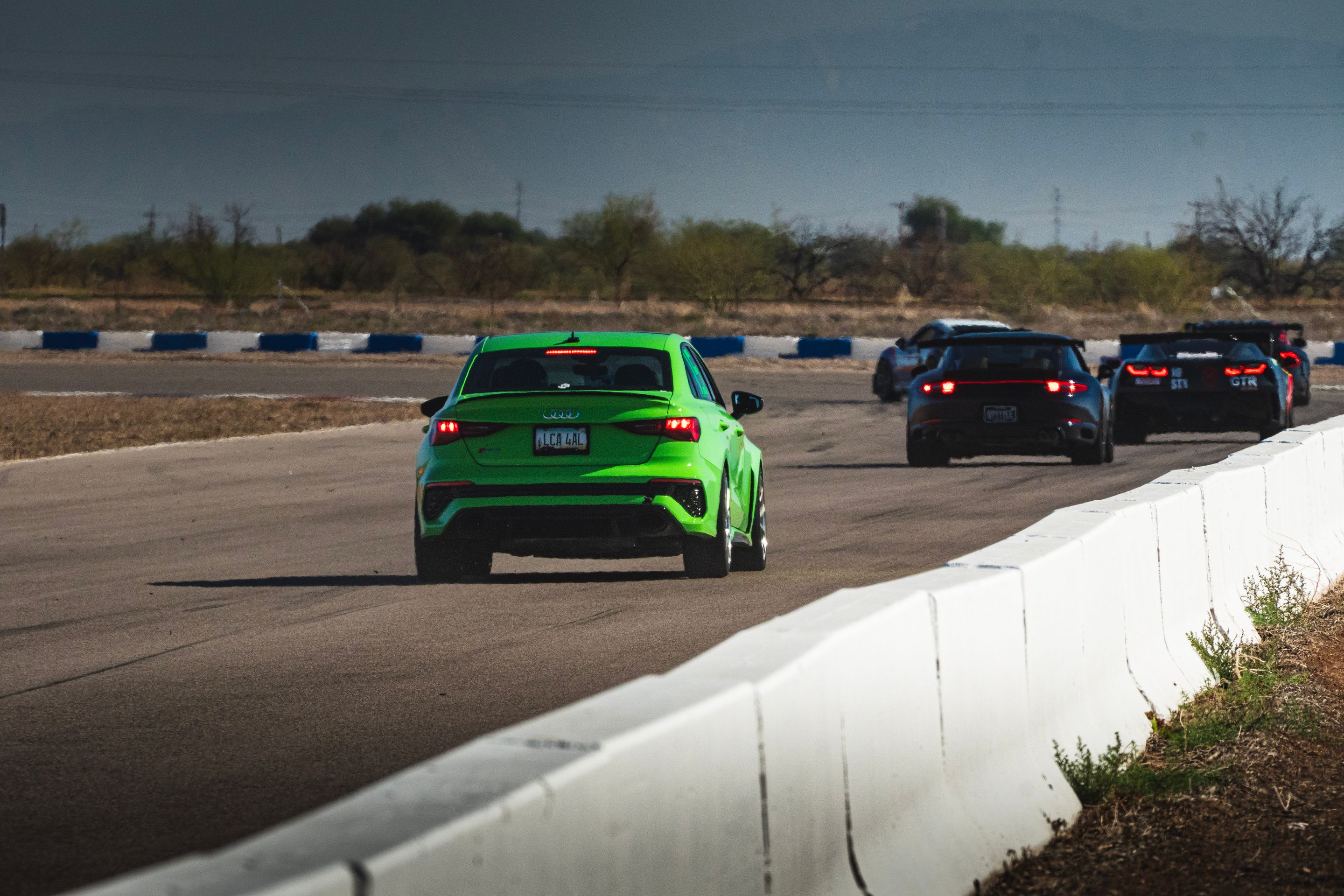 Green Audi 8Y RS 3 with 18" VS-5RS Apex wheels in Brushed Clear