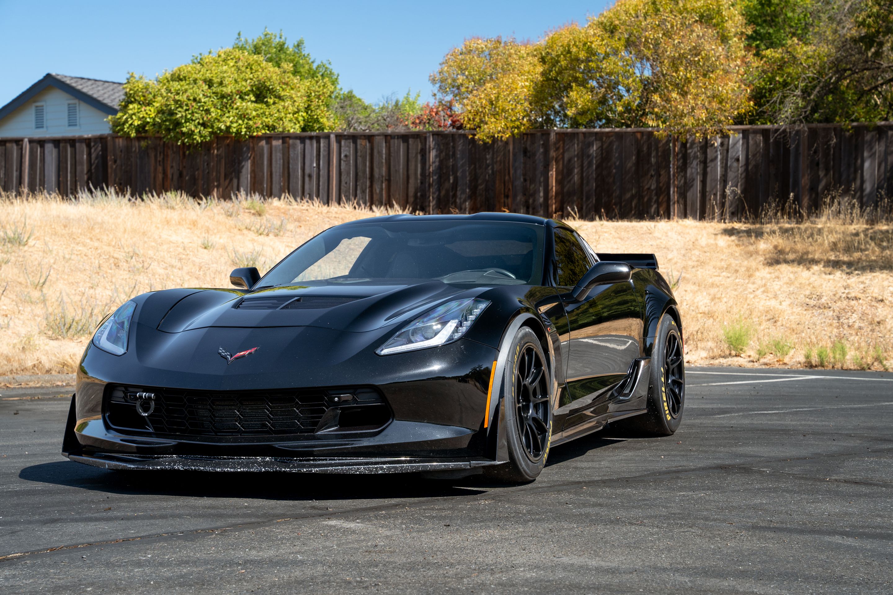 Black Chevrolet C7 Corvette Z06 with 18" SM-10RE Apex wheels in Satin Black
