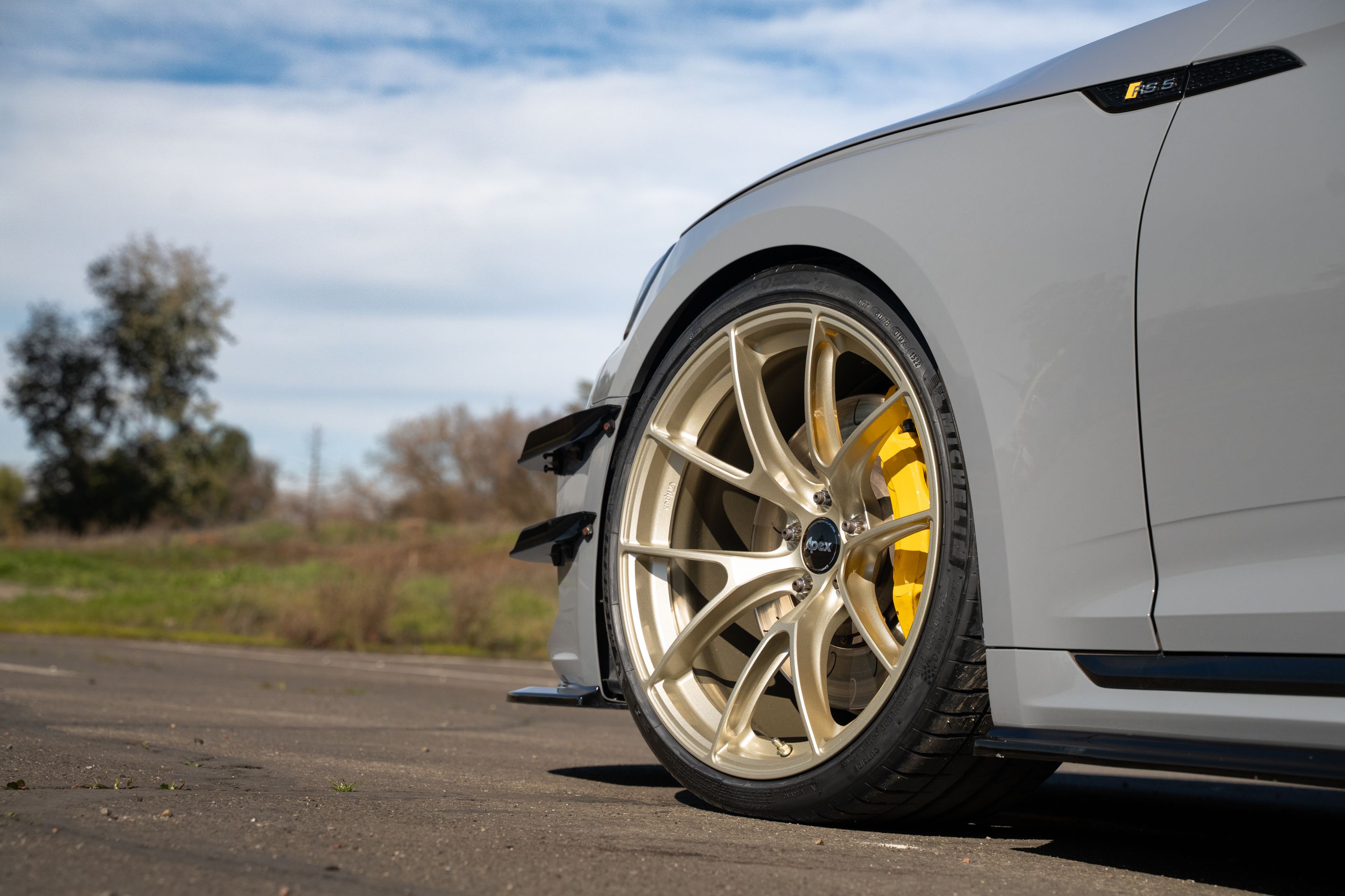 Grey Audi B9 RS 5 Coupe with 20" VS-5RS Apex wheels in Motorsport Gold