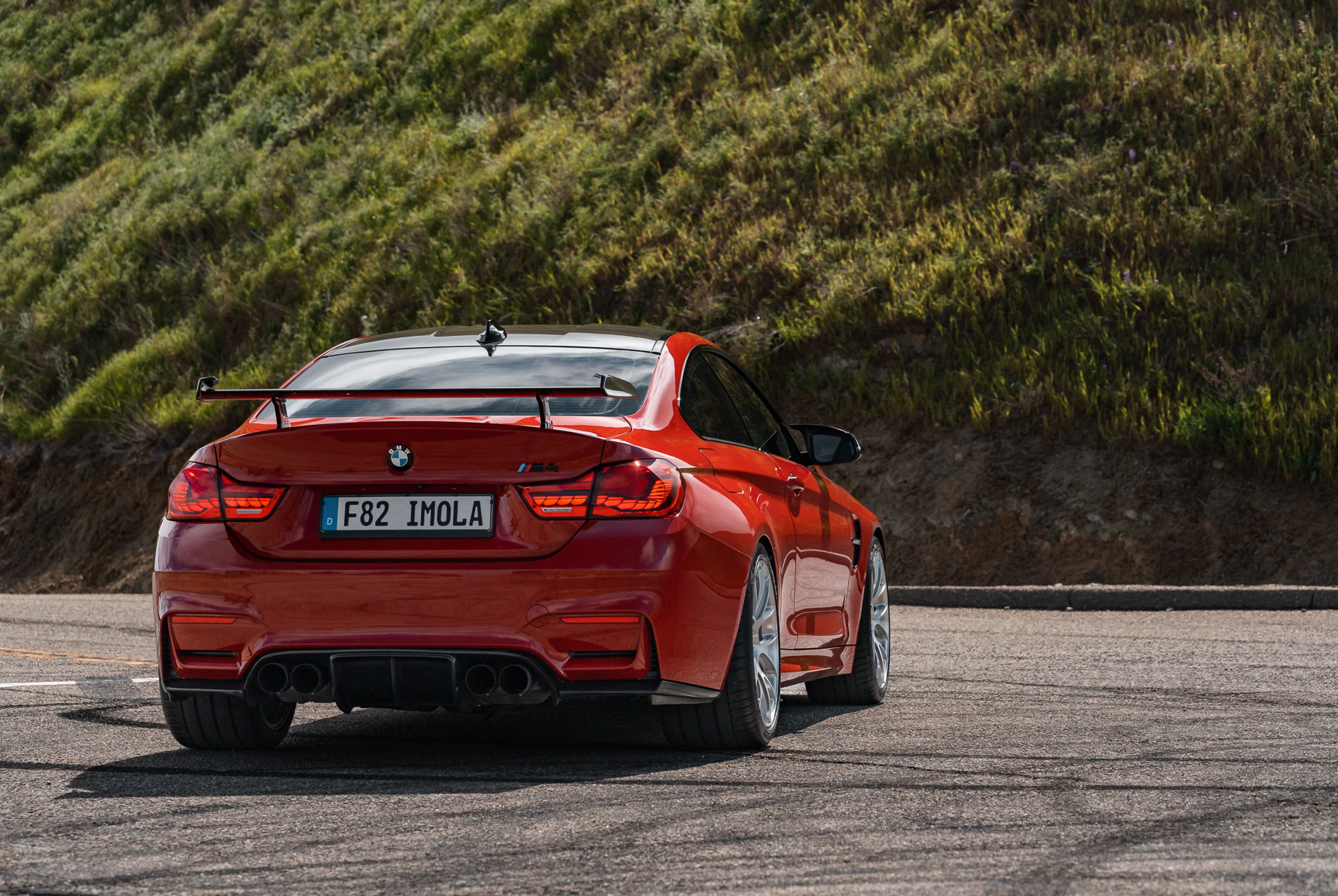 Red BMW F82 Coupe M4 with 19" EC-7RS Apex wheels in Brushed Clear