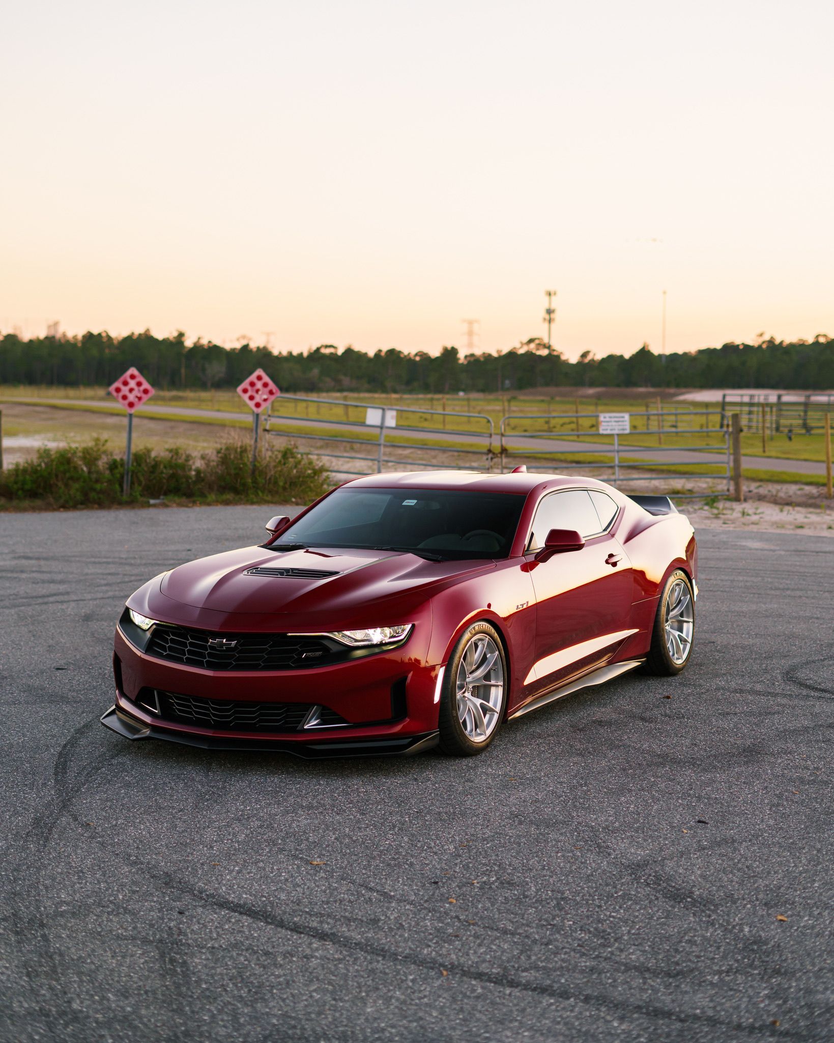 Red Chevrolet 6th Gen Camaro LT1 with 19" VS-5RS Apex wheels in Brushed Clear