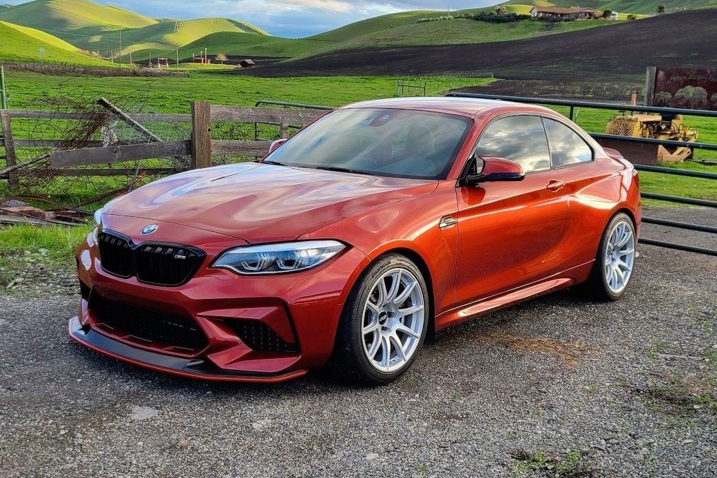 Orange BMW F87 M2 with 18"/19" SM-10 Apex wheels in Race Silver