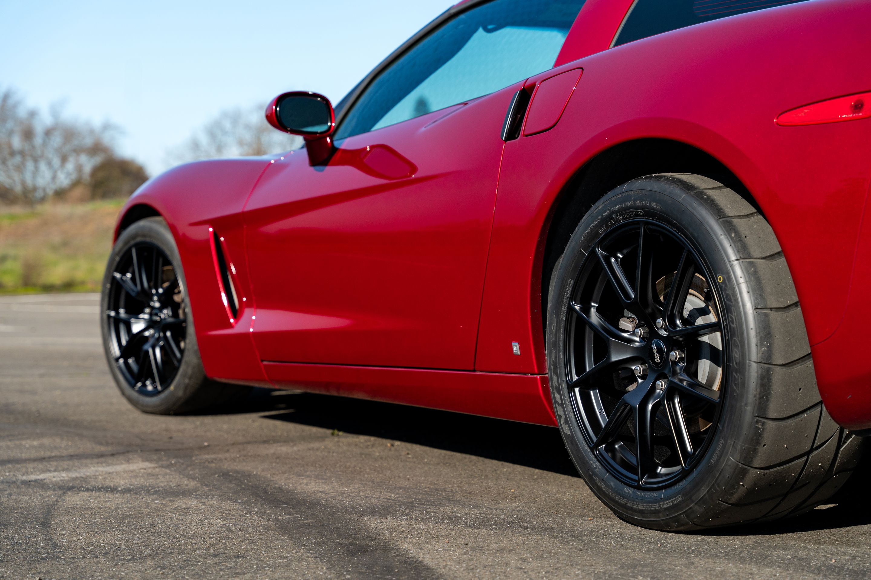 Red Chevrolet C6 Corvette Base/Z51 with 18" VS-5 Apex wheels in Satin Black