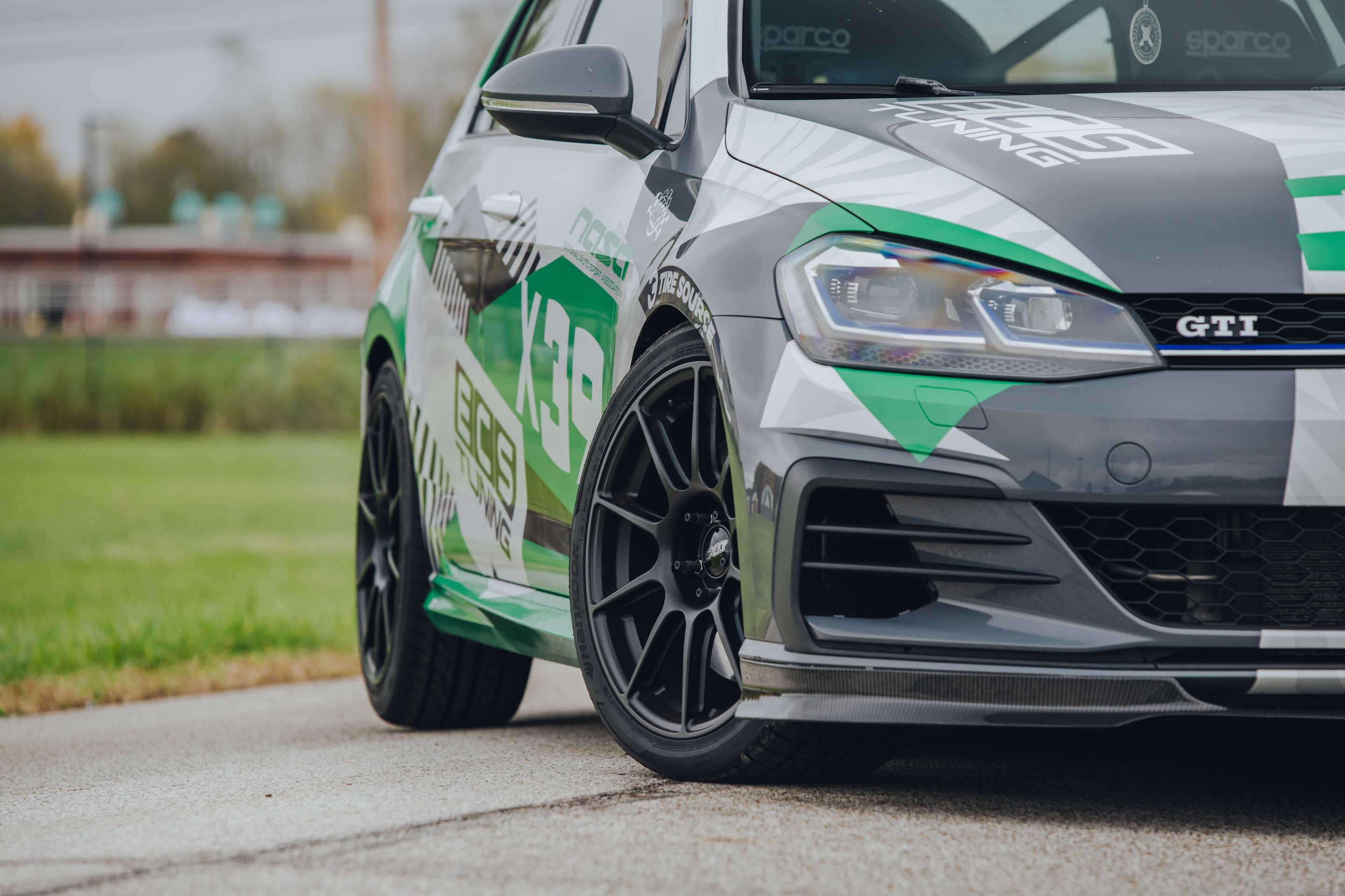 Race Livery VW MK7 GTI with 18" SM-10 Apex wheels in Satin Black