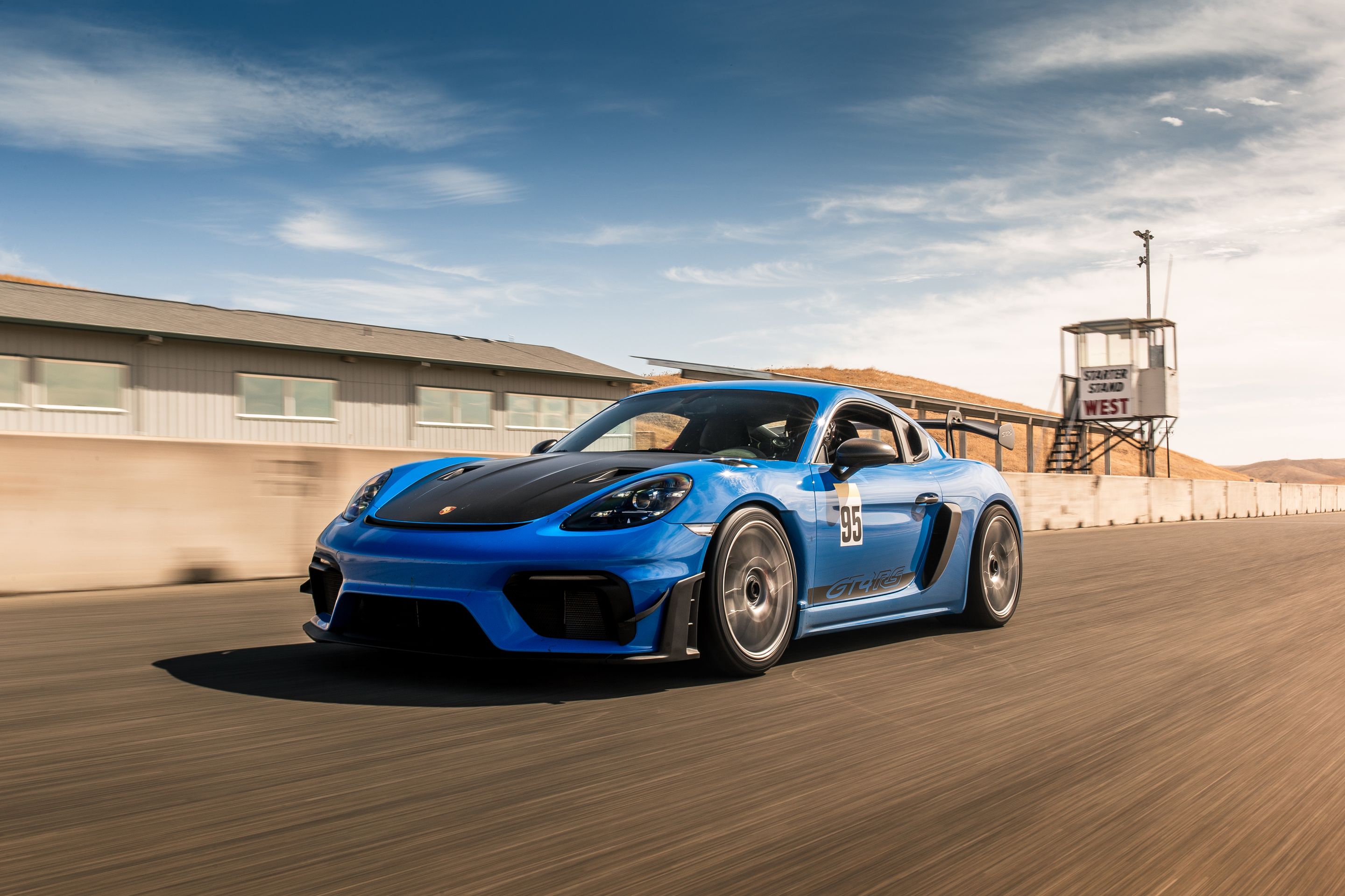 Blue Porsche 718 Cayman GT4 RS with 19" EC-7RS Apex wheels in Race Silver