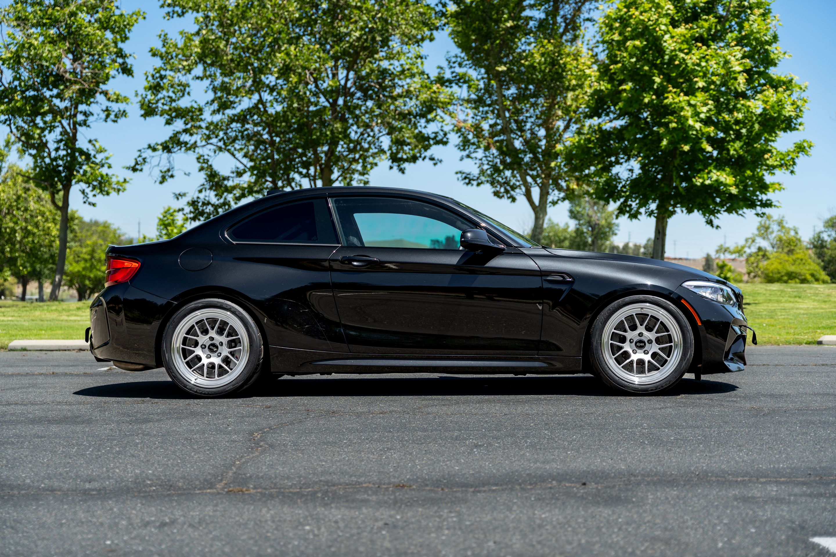 Black BMW F87 M2 with 18" ML-7RT Apex wheels in Machined Lip Race Silver