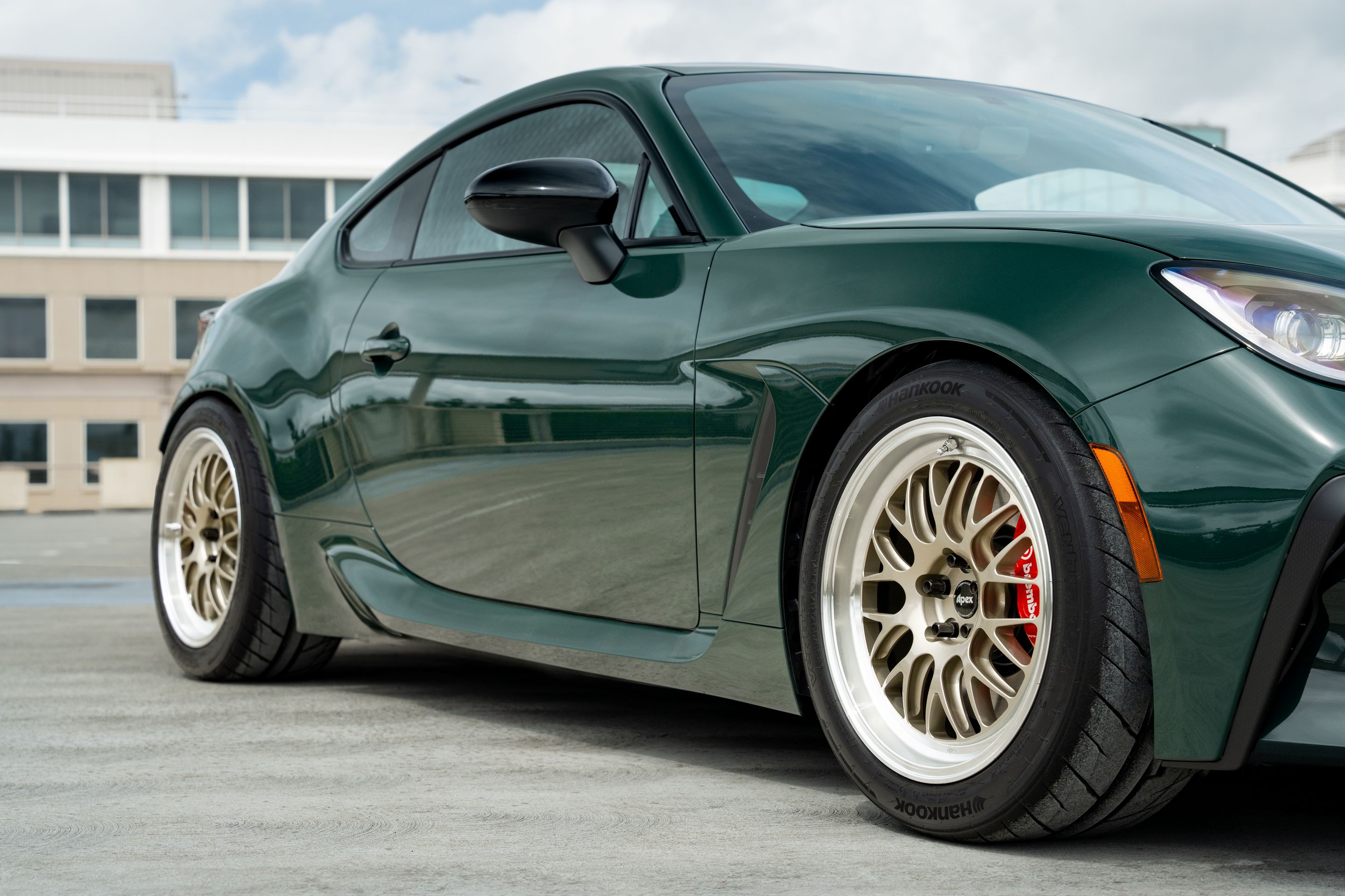 Green Toyota GR86 with 17" ML-10RT Apex wheels in Machined Lip Gloss Motorsport Gold