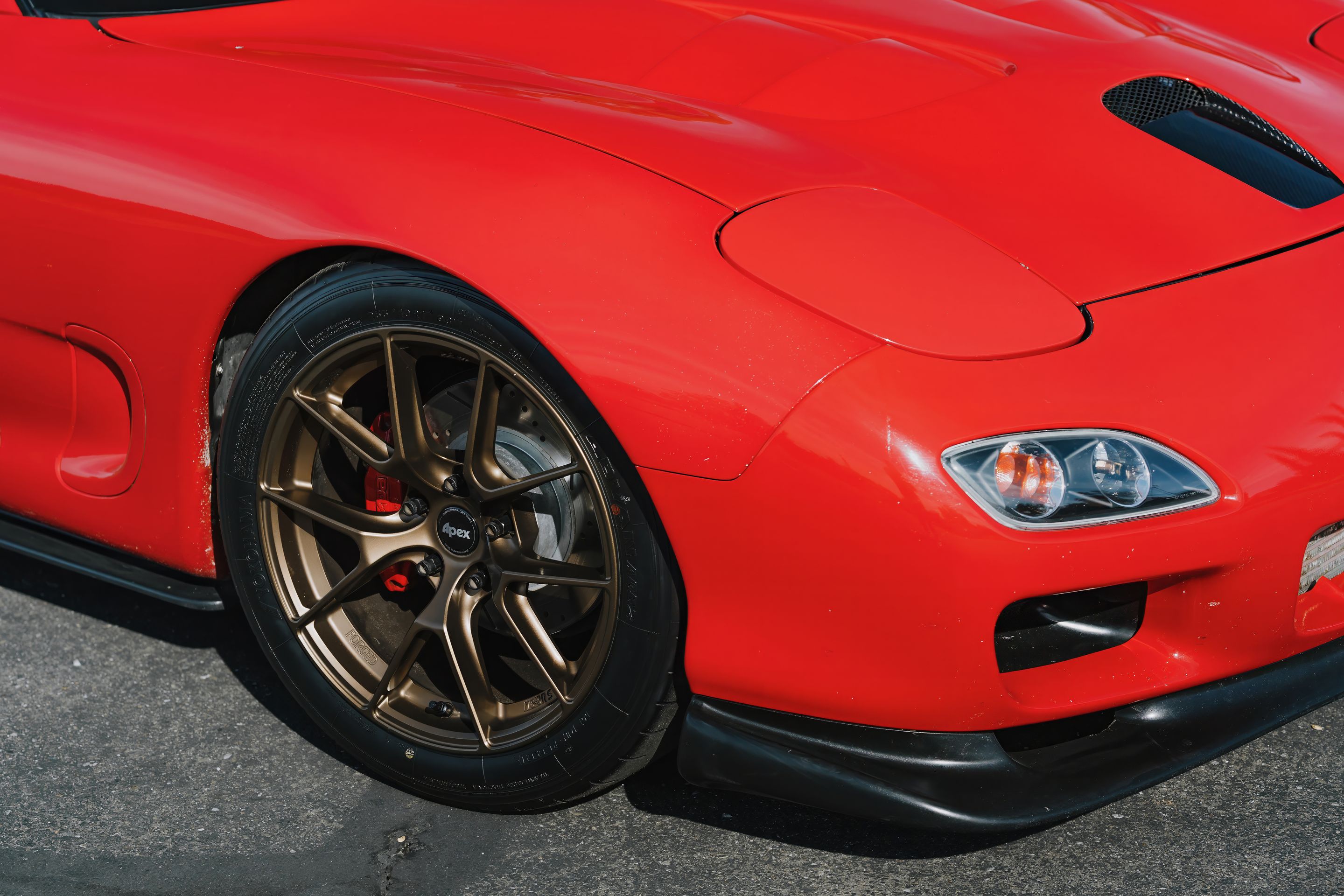 Red Mazda FD RX-7 with 17" VS-5RS Apex wheels in Satin Bronze