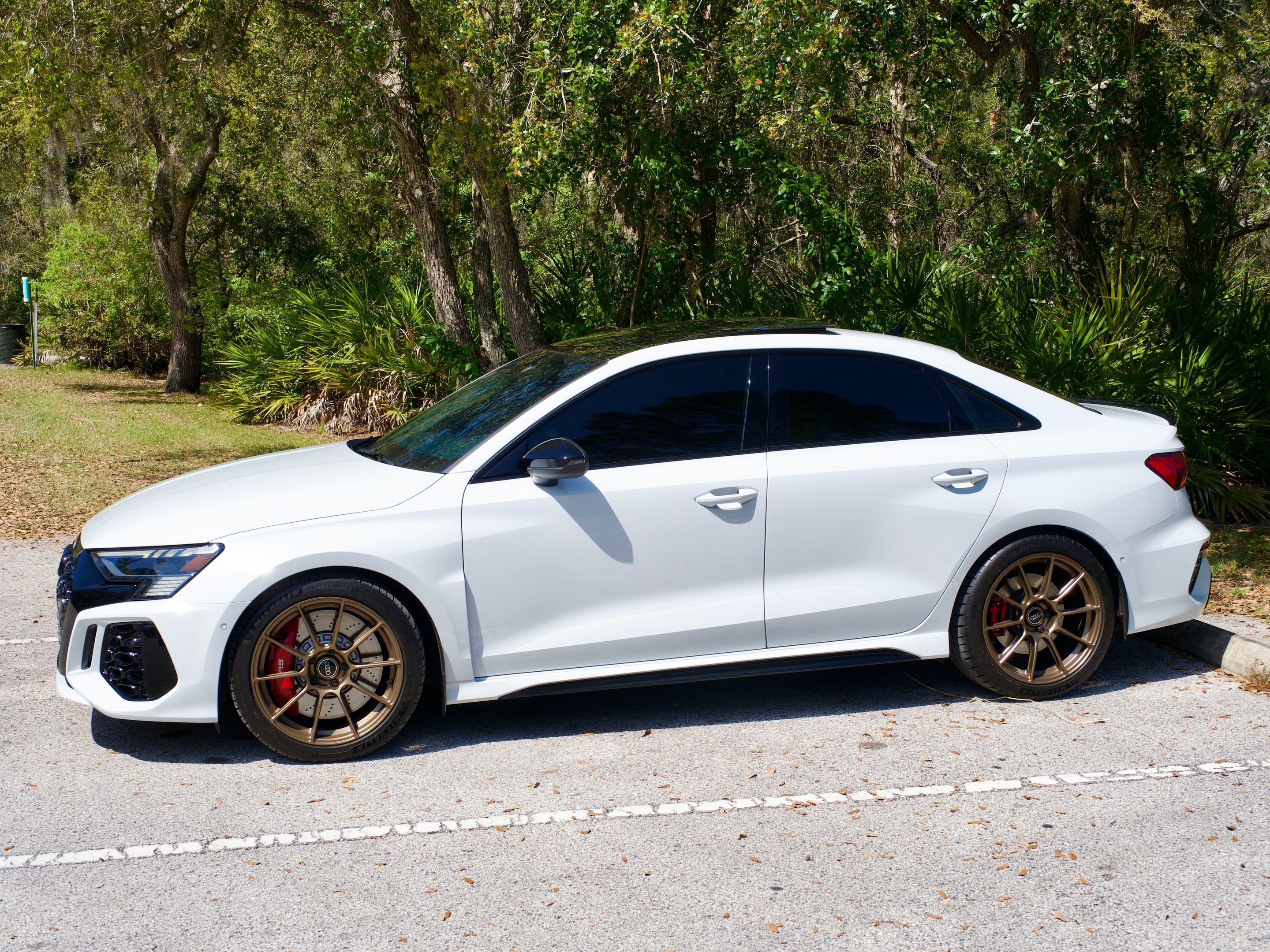 White Audi 8Y RS 3 with 18" SM-10RS Apex wheels in Satin Bronze