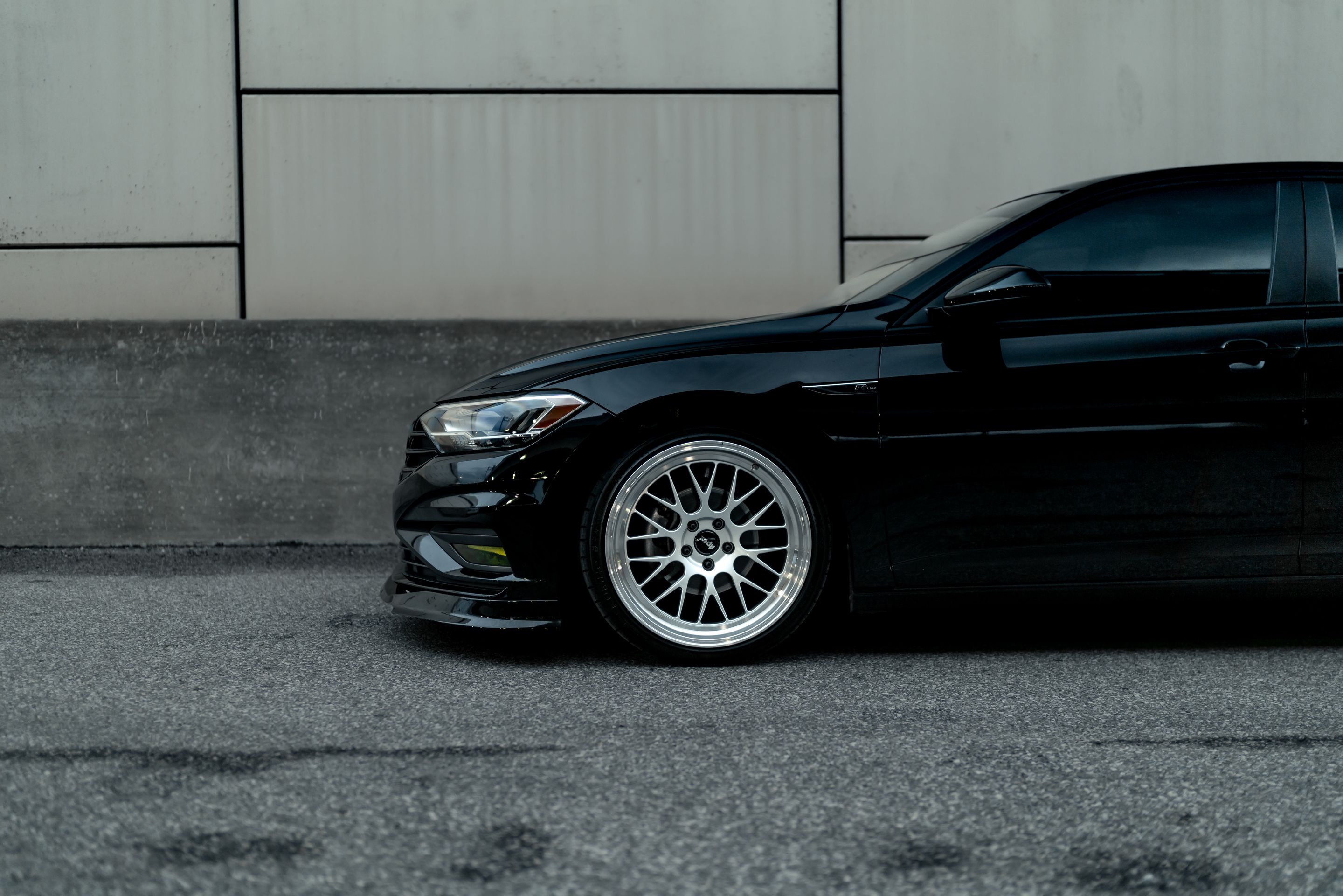 Black VW MK7 Jetta with 19" ML-10RT Apex wheels in Machined Lip Race Silver