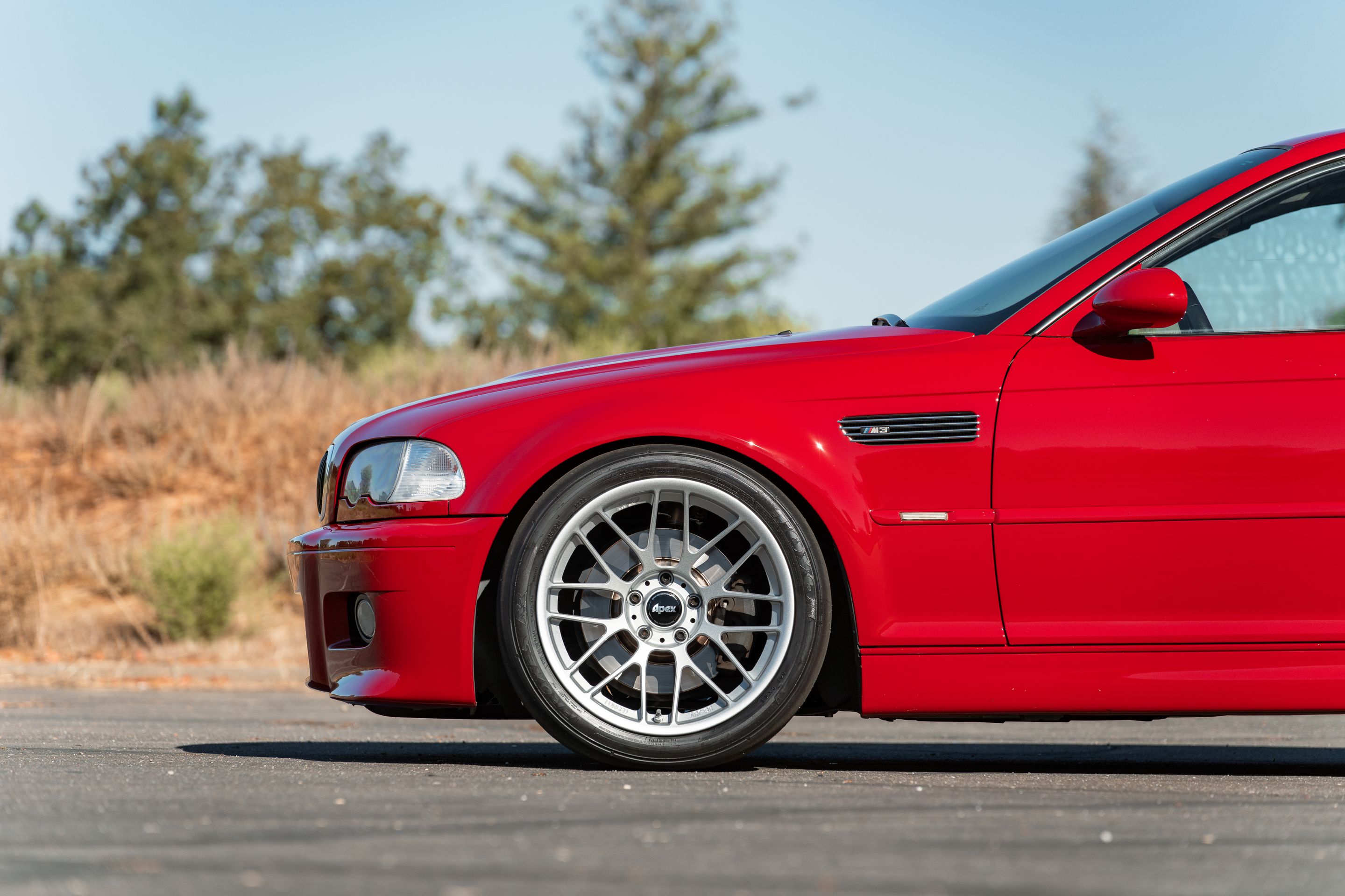 Red BMW E46 M3 with 18" ARC-8RT Apex wheels in Race Silver