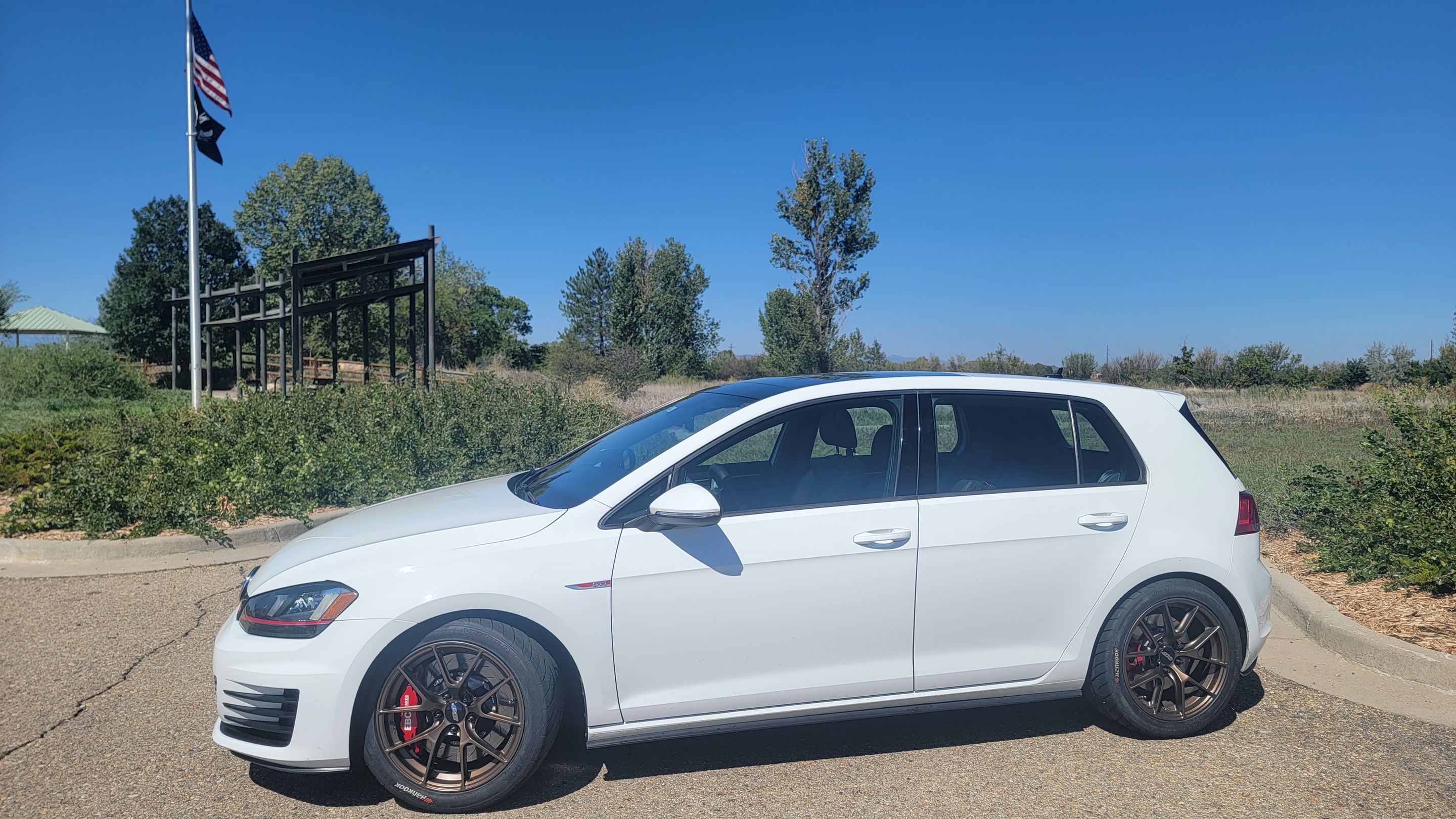 White VW MK7 GTI with 17" VS-5RS Apex wheels in Satin Bronze
