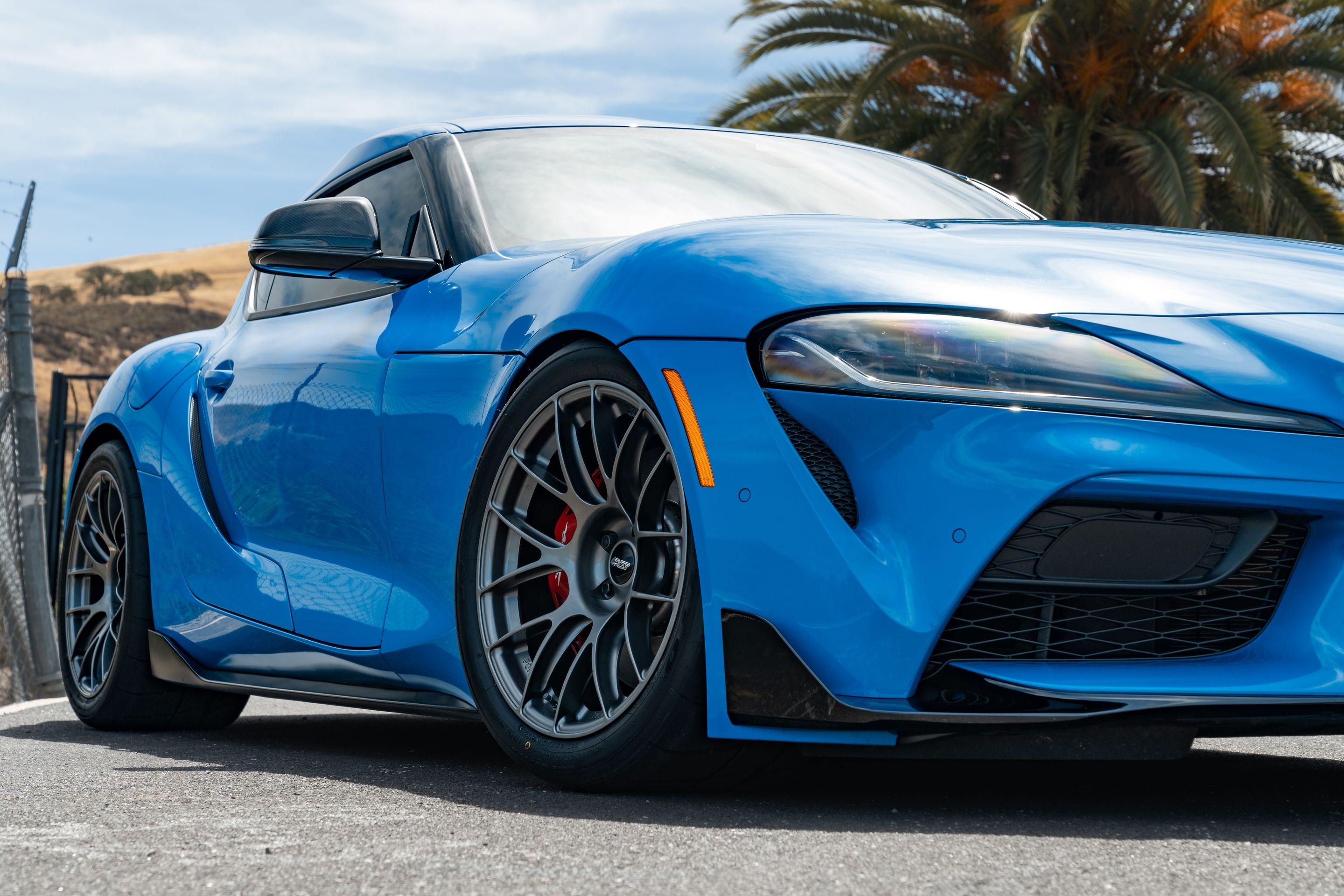 Blue Toyota GR Supra with 18" EC-7RS Apex wheels in Anthracite