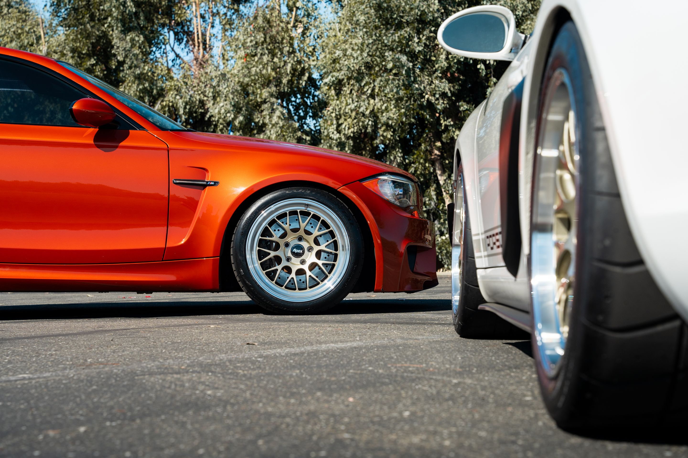 Orange BMW E82 1M with 18" ML-10RT Apex wheels in Machined Lip Gloss Motorsport Gold
