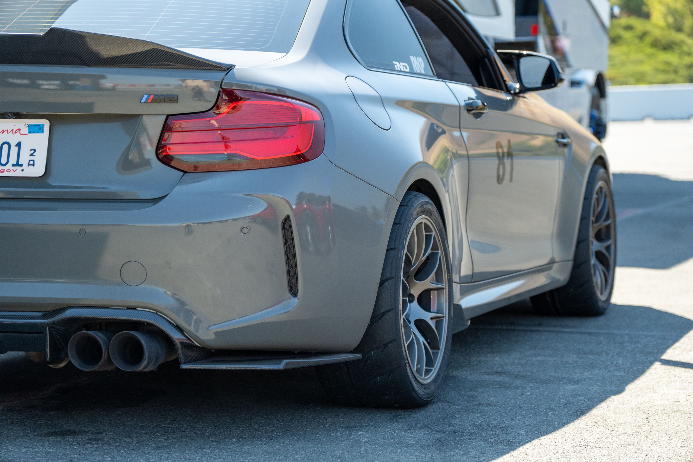 Grey BMW F87 M2 with 18" EC-7 Apex wheels in Anthracite