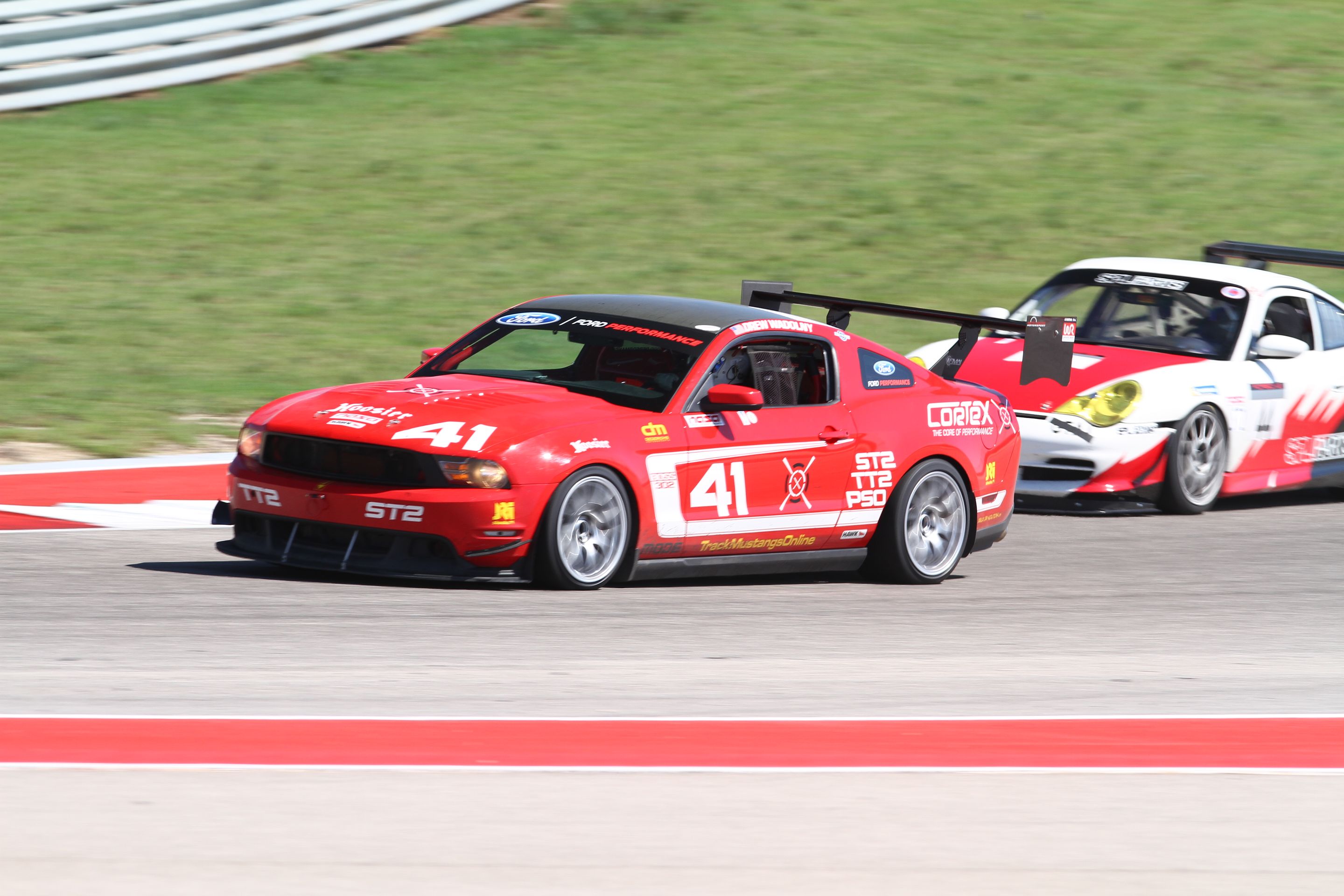 Red Ford S197 Mustang Boss 302 with 18" EC-7 Apex wheels in Race Silver