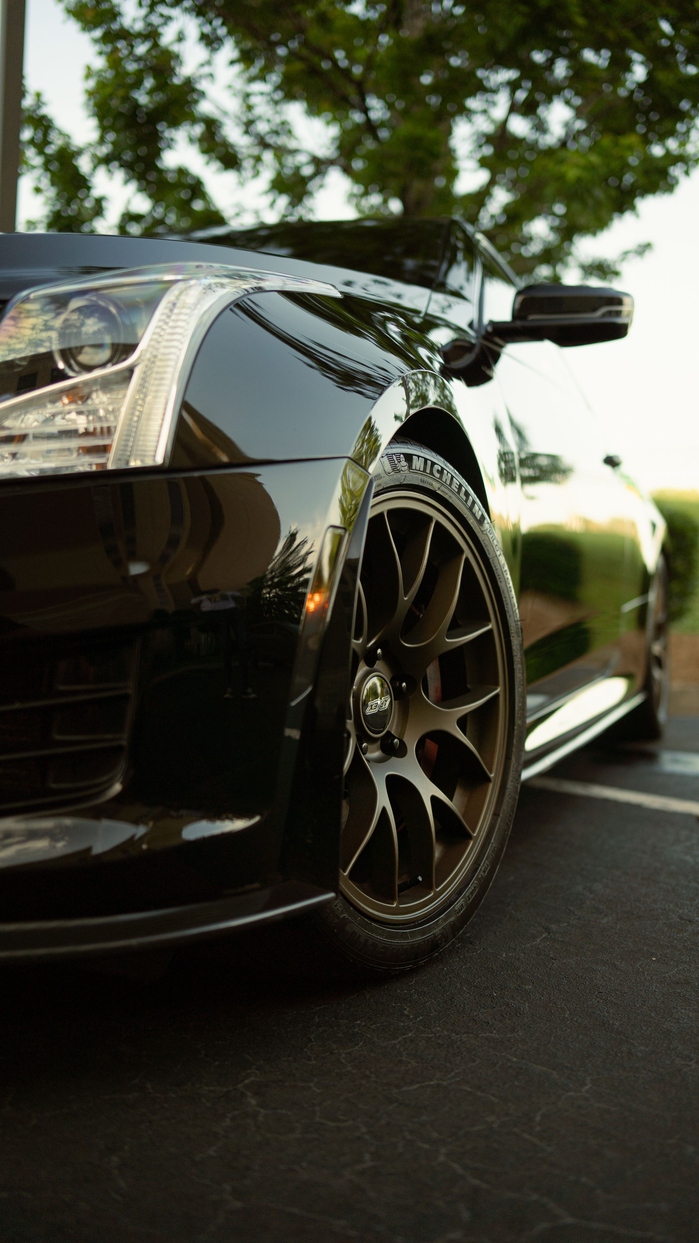 Black Cadillac ATS-V with 18" EC-7 Apex wheels in Satin Bronze