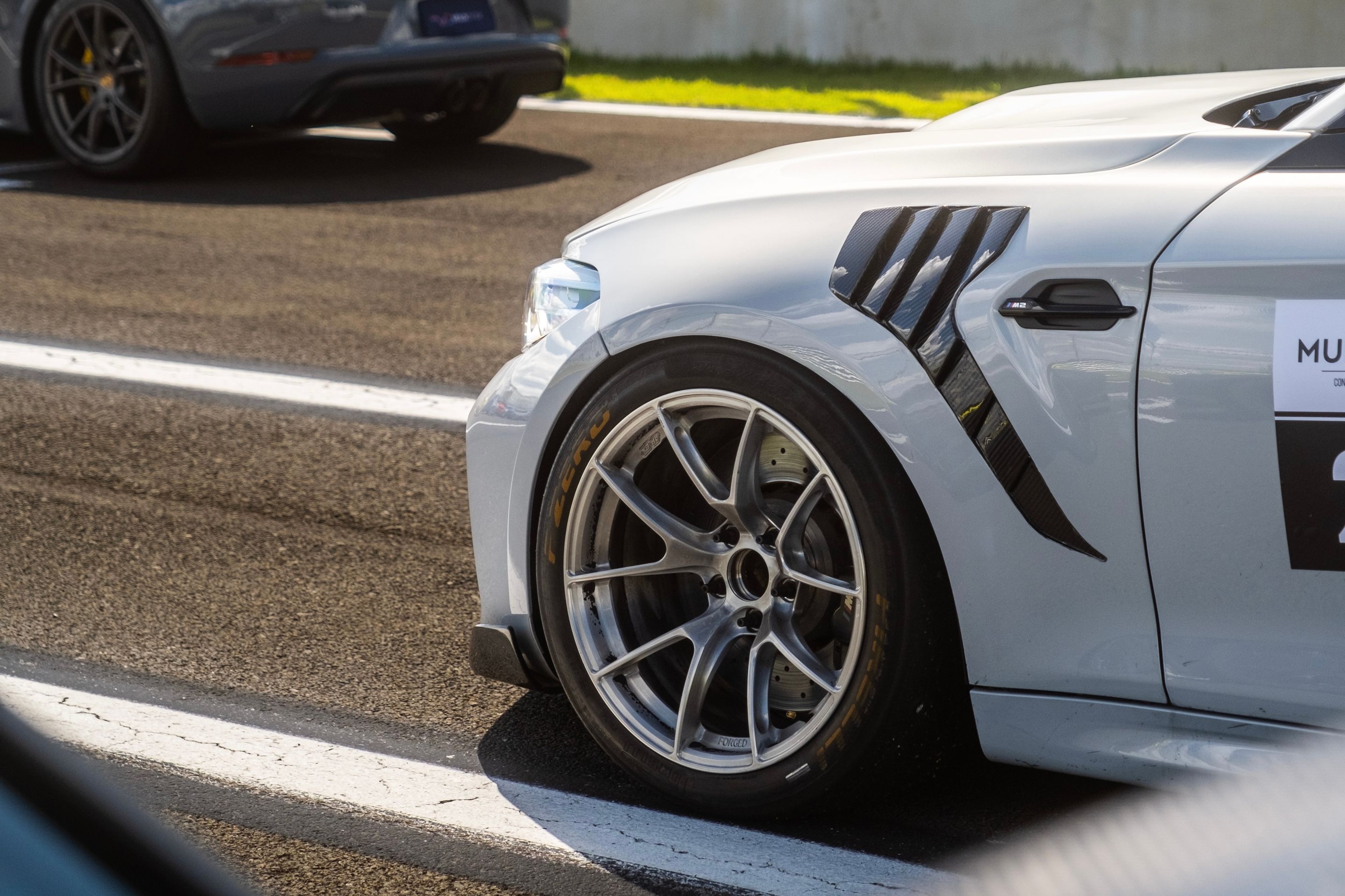 Silver BMW F87 M2 with 18" VS-5RS Apex wheels in Brushed Clear