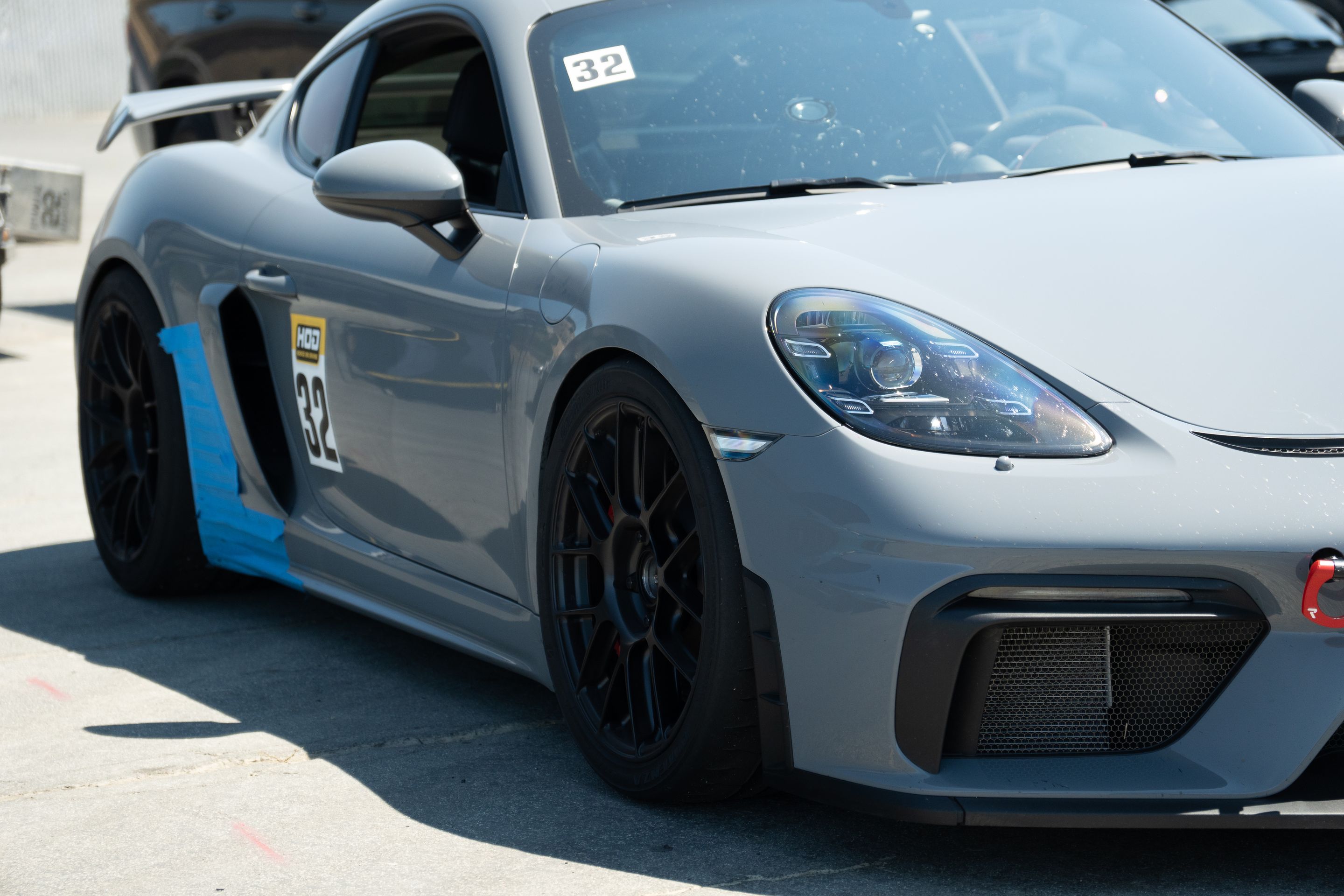 Grey Porsche 718 Cayman GT4 with 19" EC-7RS Apex wheels in Satin Black