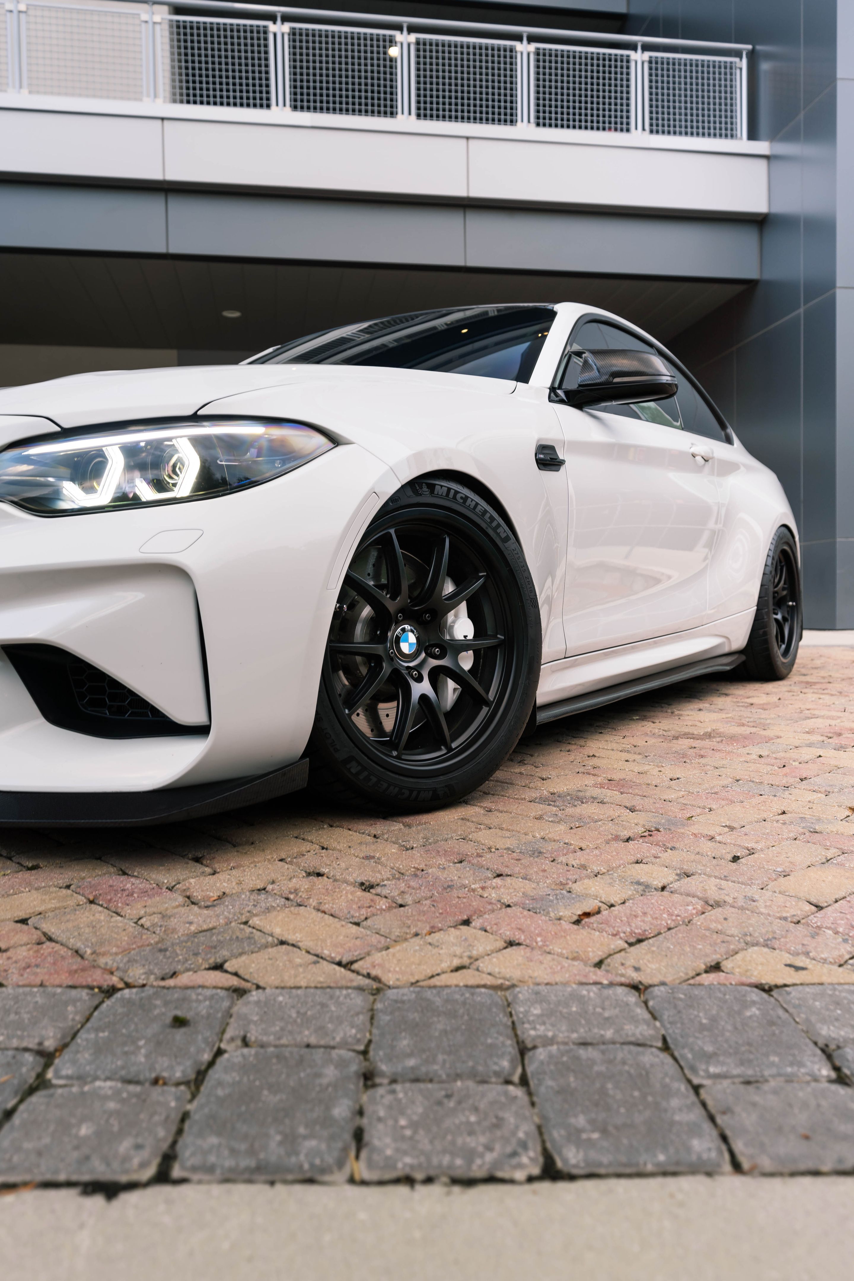 White BMW F87 M2 with 18" FL-5 Apex wheels in Satin Black