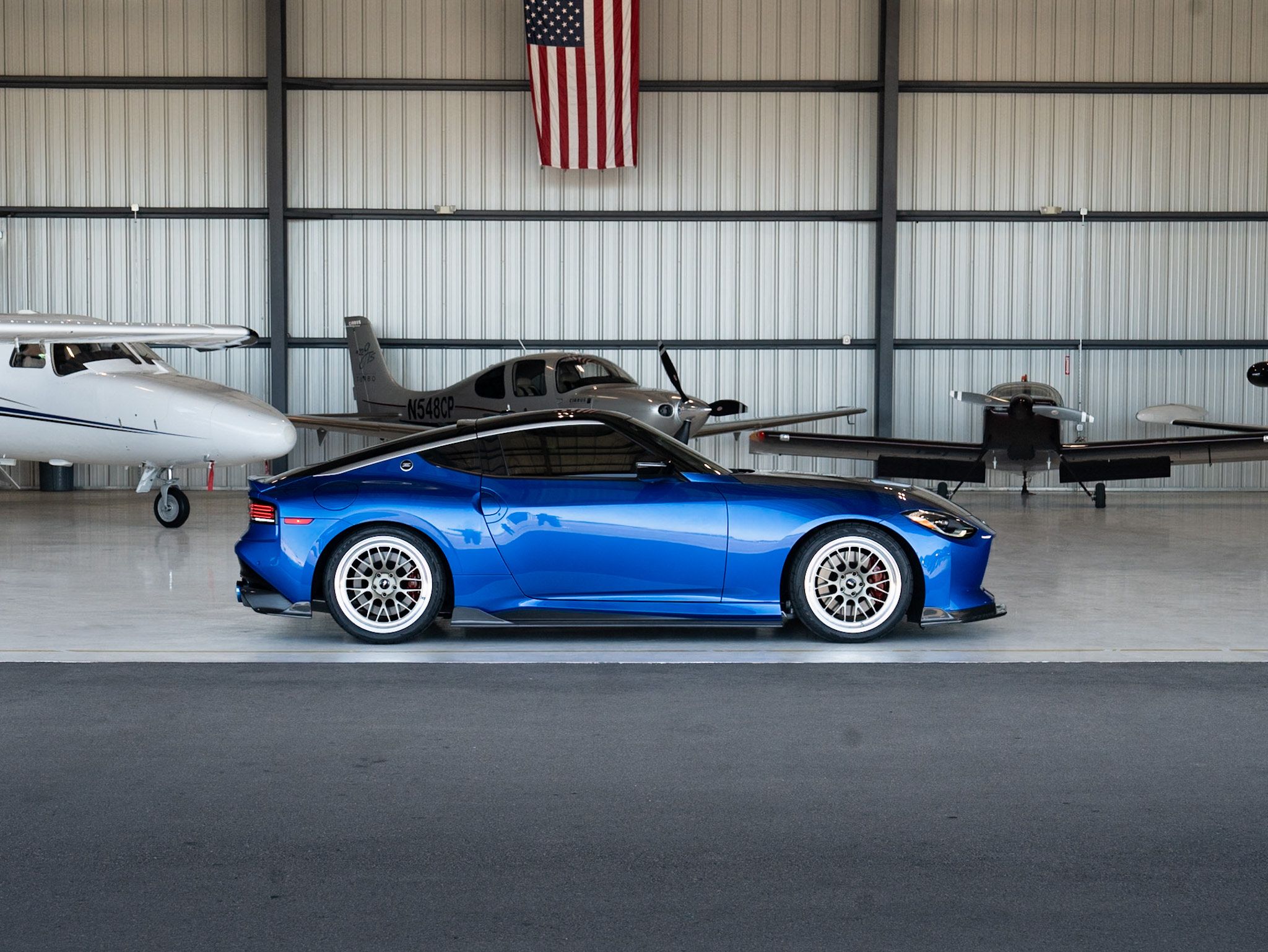 Blue Nissan Z with 19" ML-10RT Apex wheels in Machined Lip Gloss Motorsport Gold
