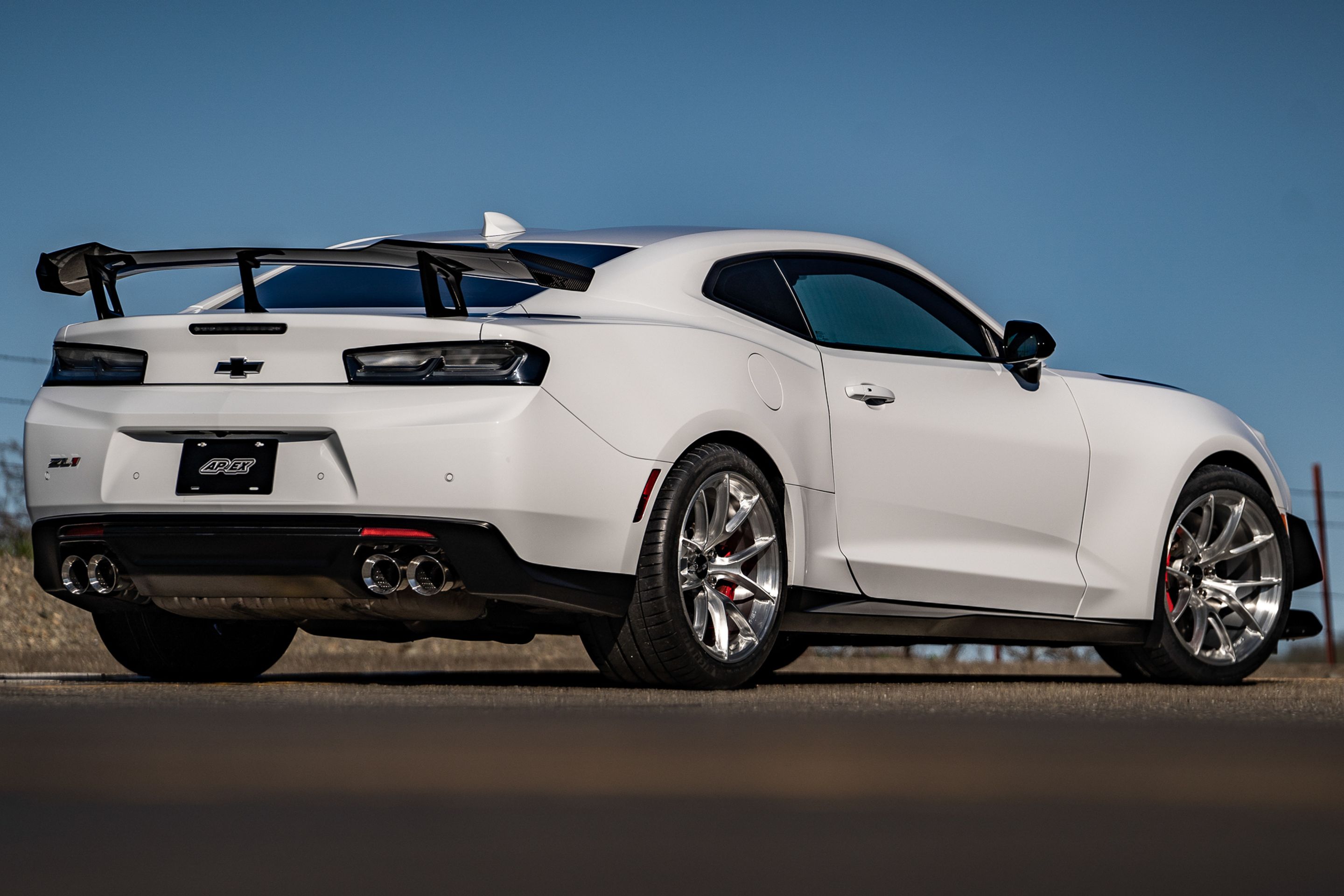 White Chevrolet 6th Gen Camaro ZL1 1LE with 19" VS-5RS Apex wheels in Brushed Clear