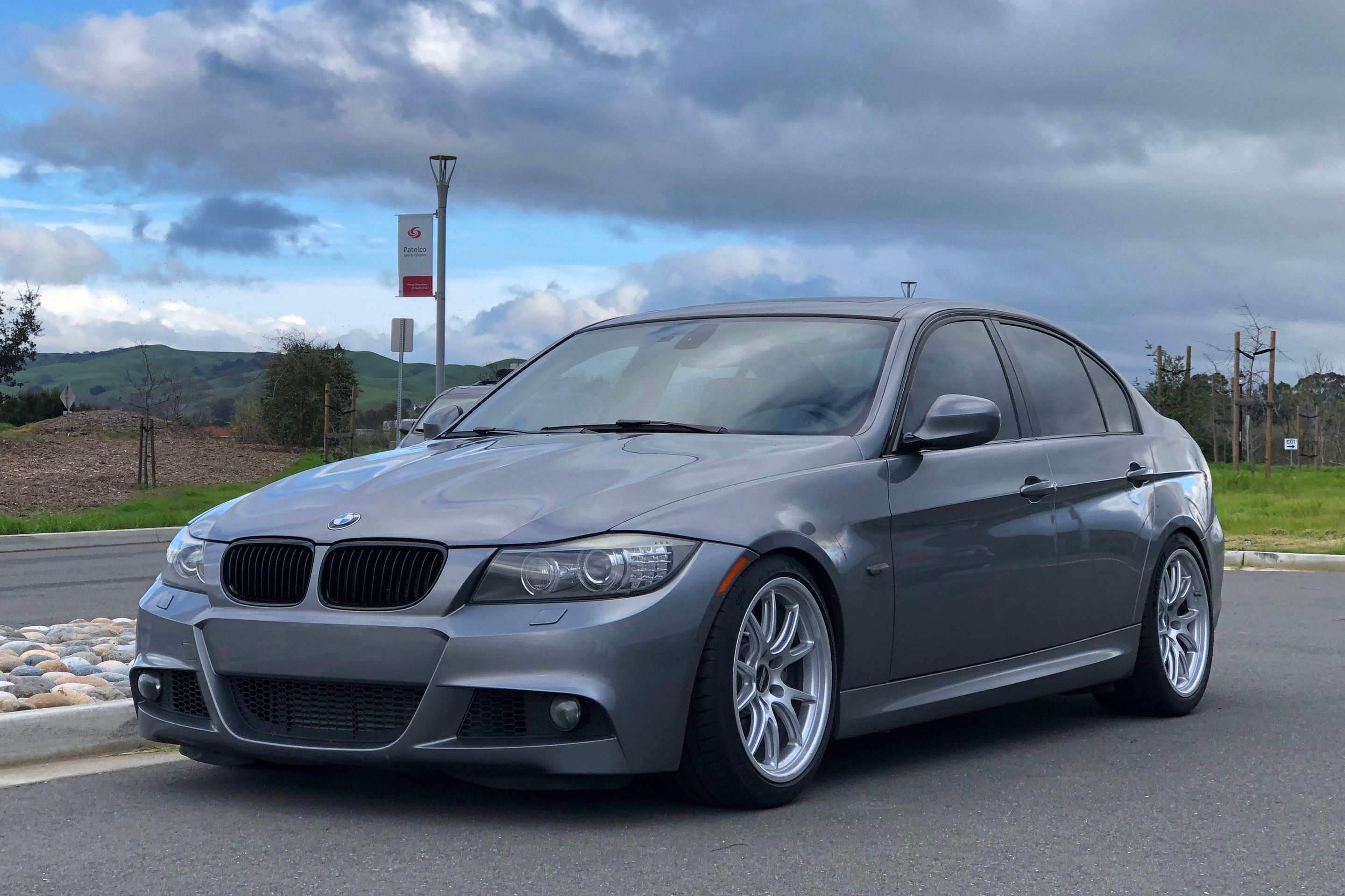 Grey BMW E90 LCI Sedan 3 Series with 18" FL-5 Apex wheels in Race Silver