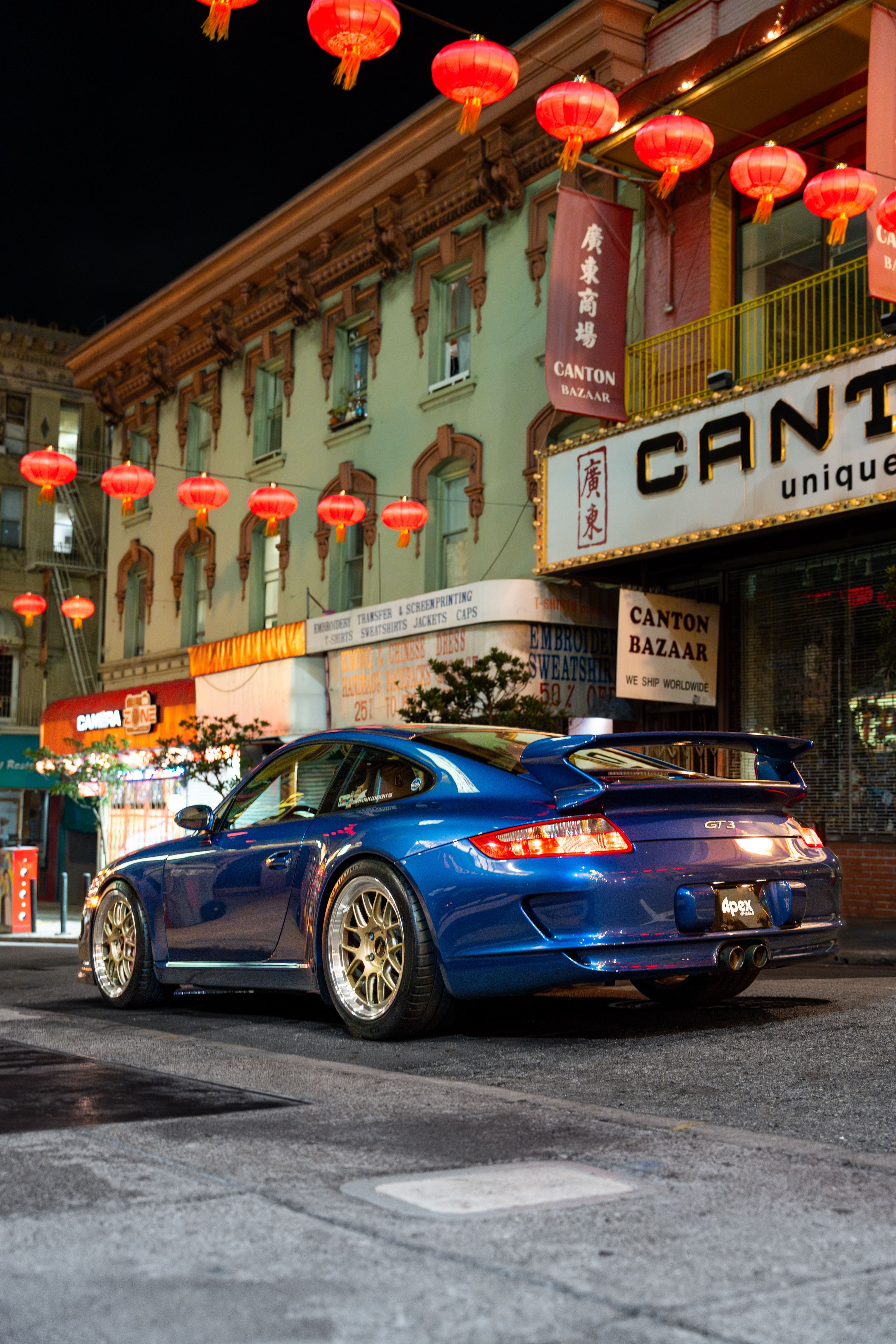 Blue Porsche 911 997 GT3 with 19" TEST-M Apex wheels in Machined Lip Gloss Motorsport Gold