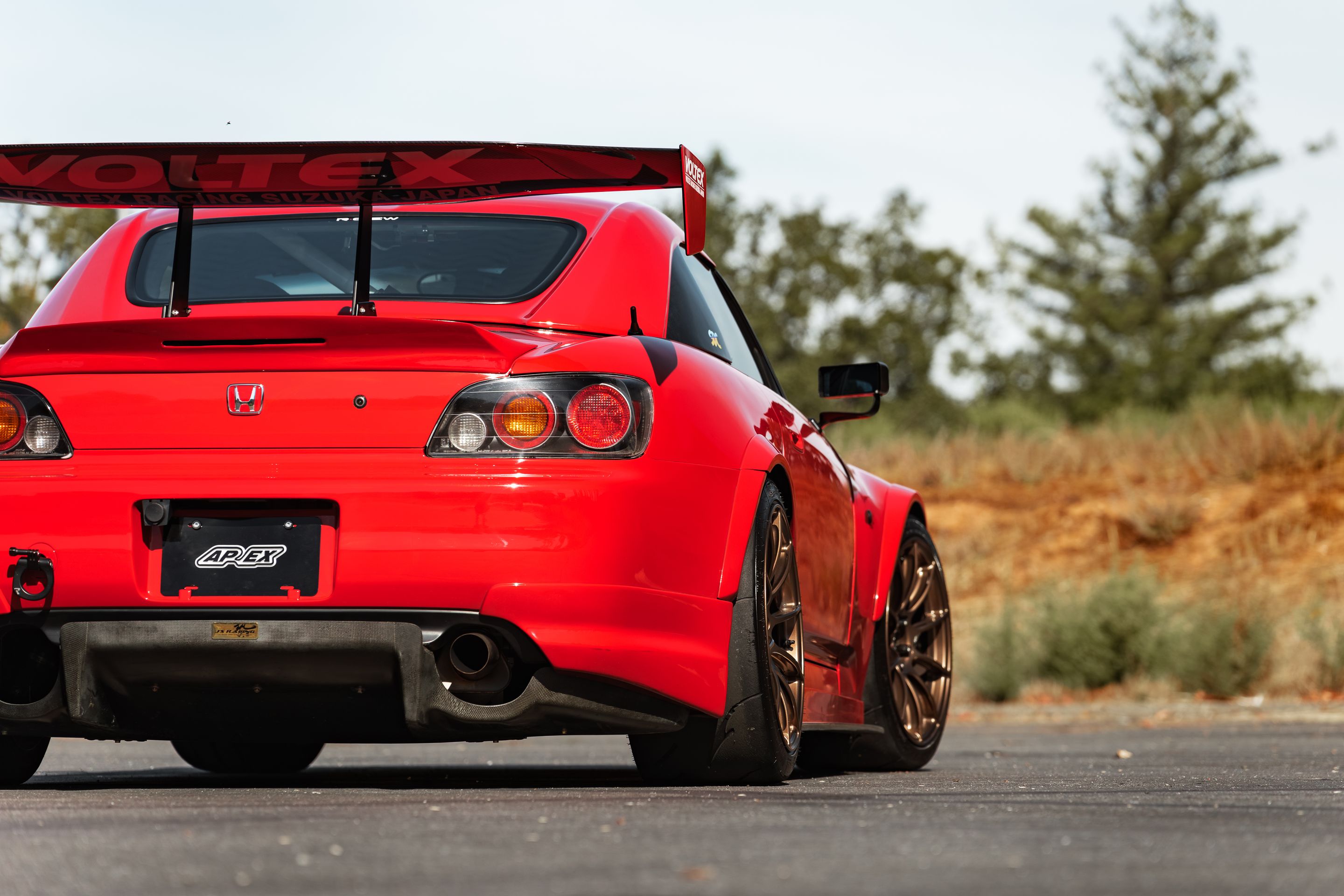Red Honda S2000 with 18" SM-10RS Apex wheels in Satin Bronze