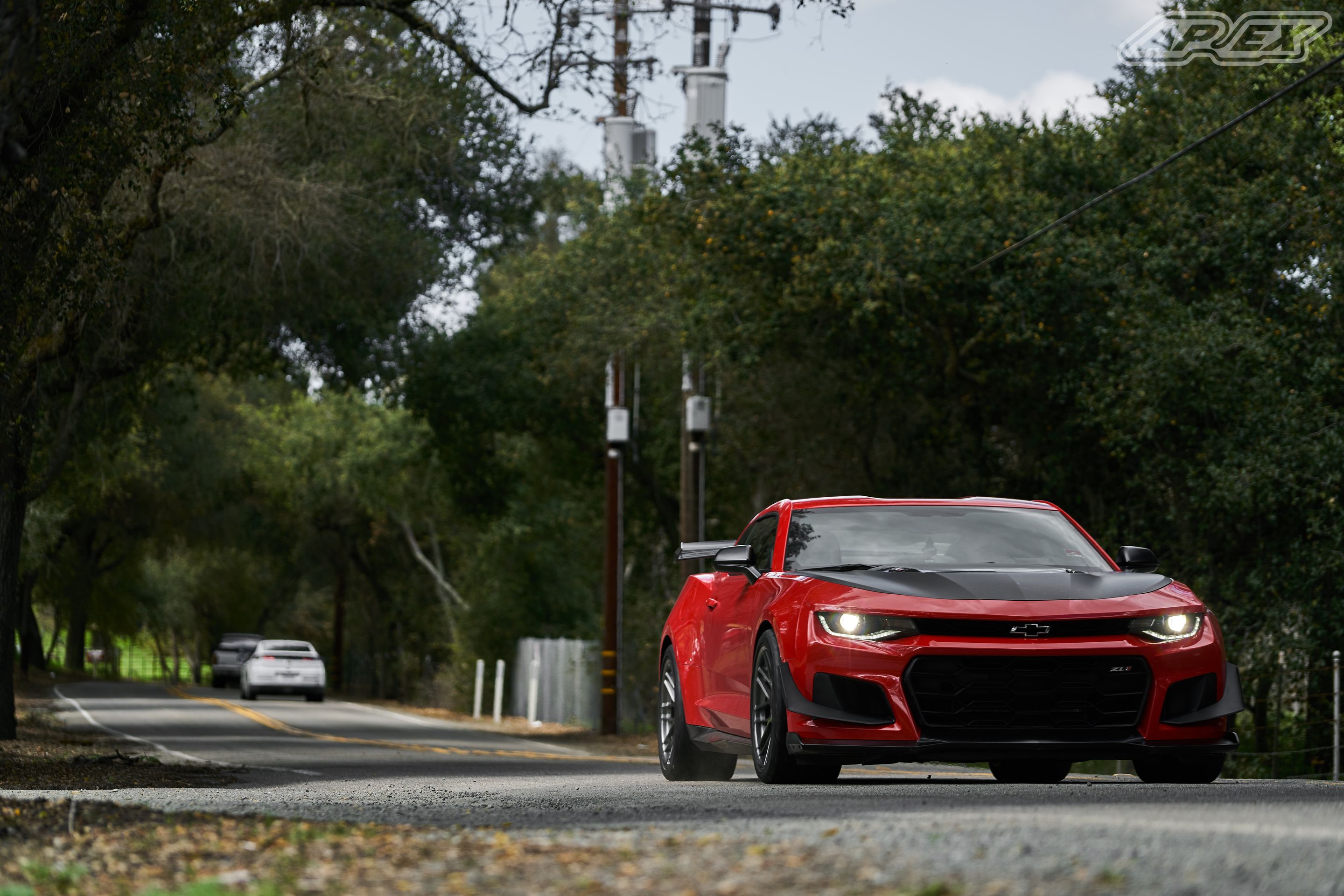Red Chevrolet 6th Gen Camaro ZL1 1LE with 19" ARC-8 Apex wheels in Anthracite