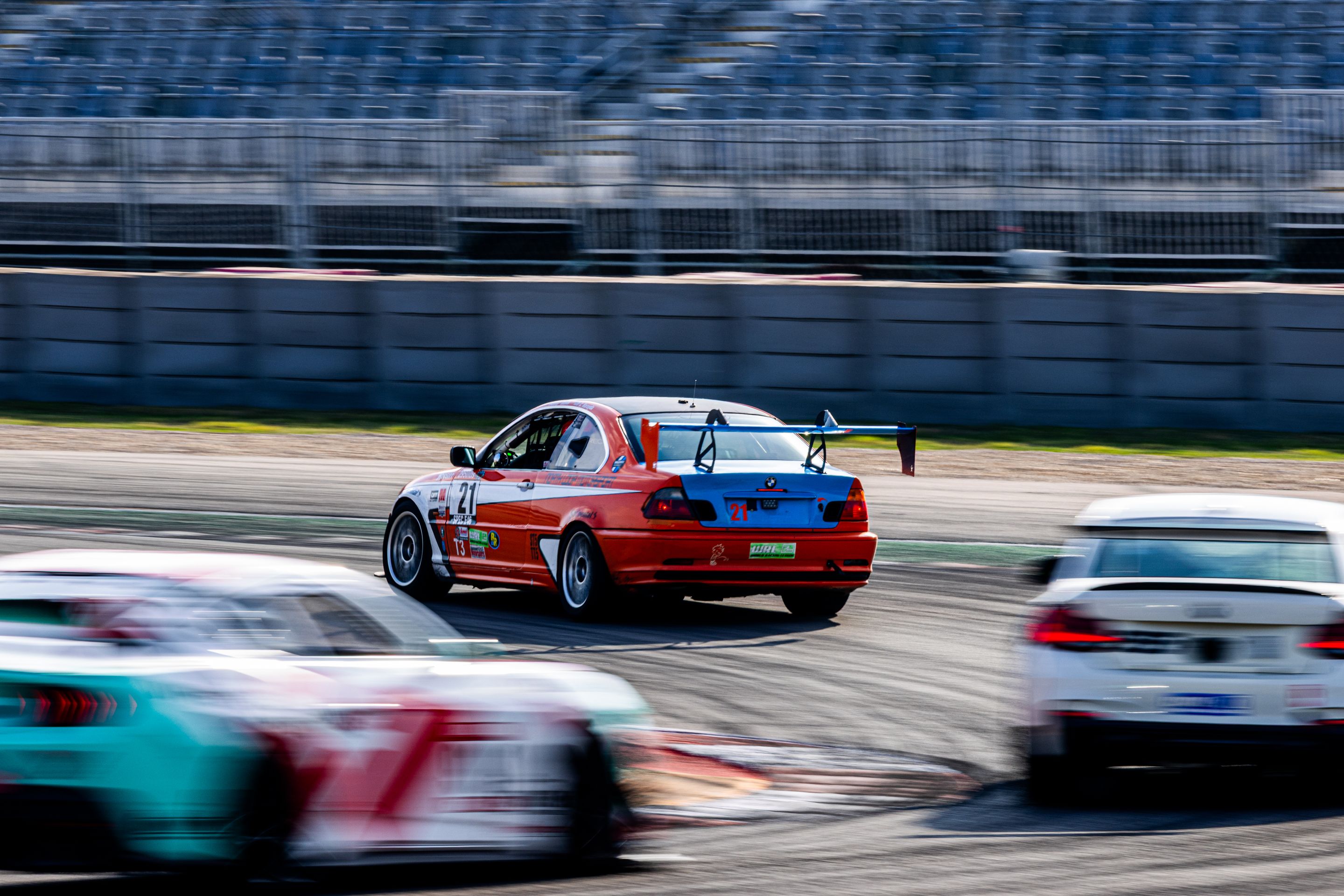 Orange BMW Spec E46 with 17" ARC-8 Apex wheels in Hyper Black