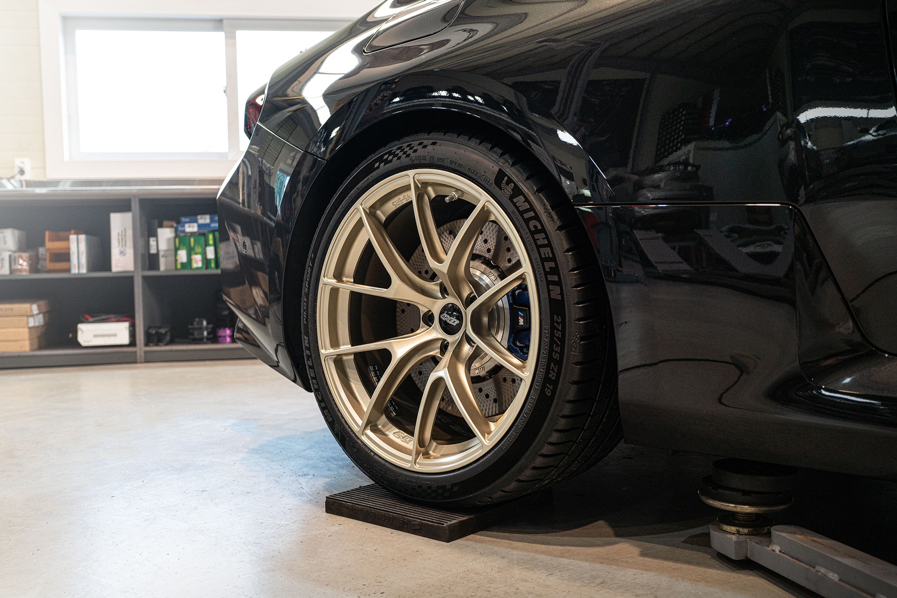 Black BMW G87 M2 with 19" VS-5RS Apex wheels in Motorsport Gold