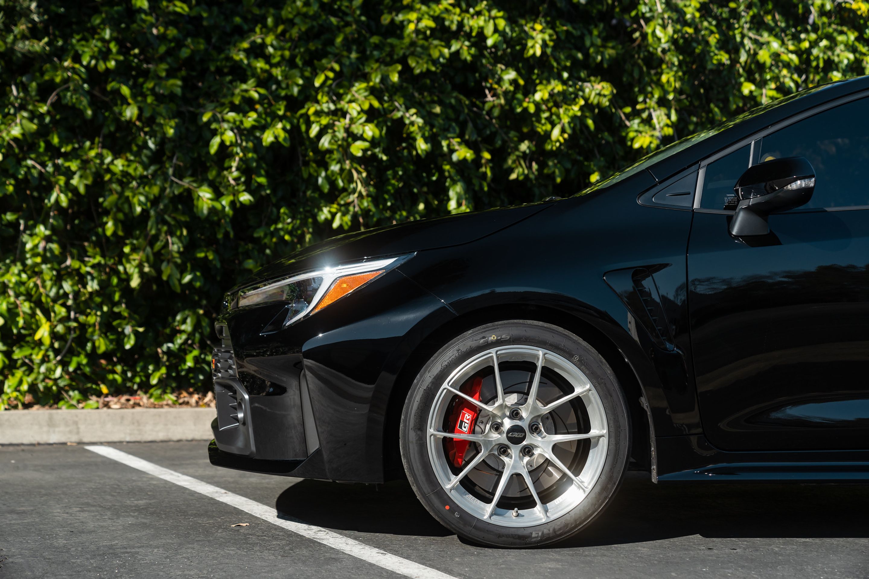 Black Toyota GR Corolla with 18" VS-5RS Apex wheels in Brushed Clear