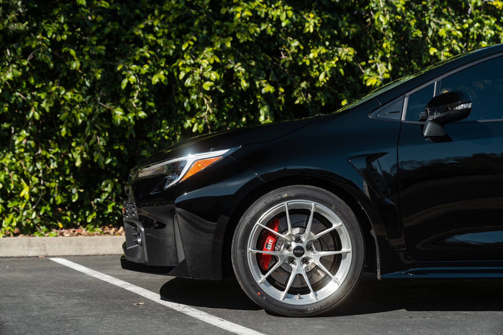 Black Toyota GR Corolla with 18" VS-5RS Apex wheels in Brushed Clear