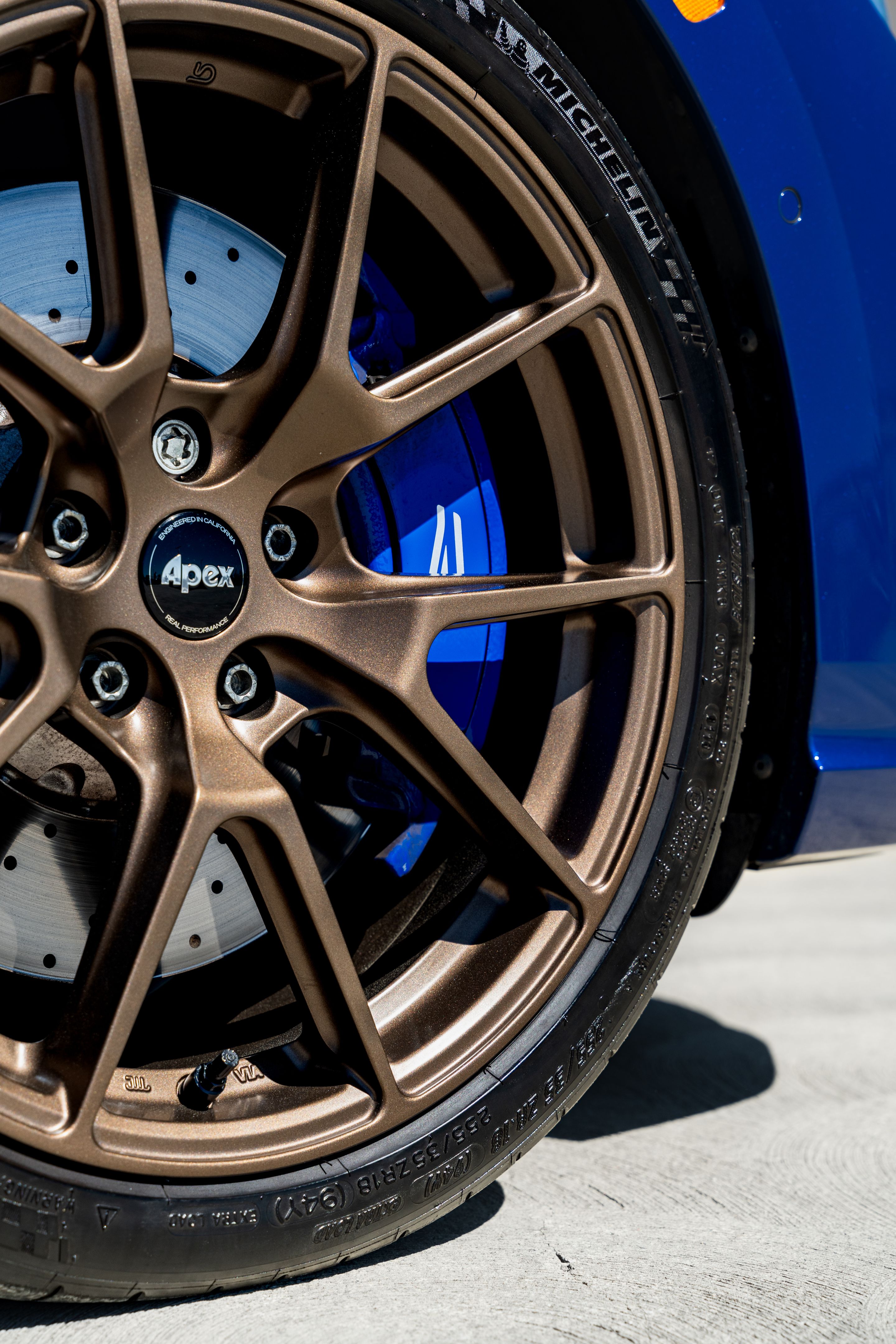 Blue VW MK8 Golf R with 18" VS-5 Apex wheels in Satin Bronze