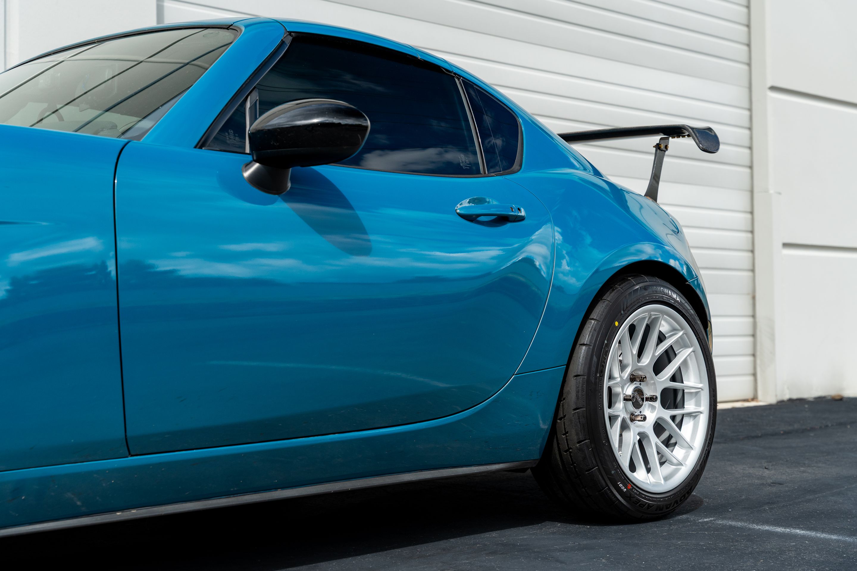 Blue Mazda ND MX-5 Miata with 17" ARC-8 Apex wheels in Race Silver