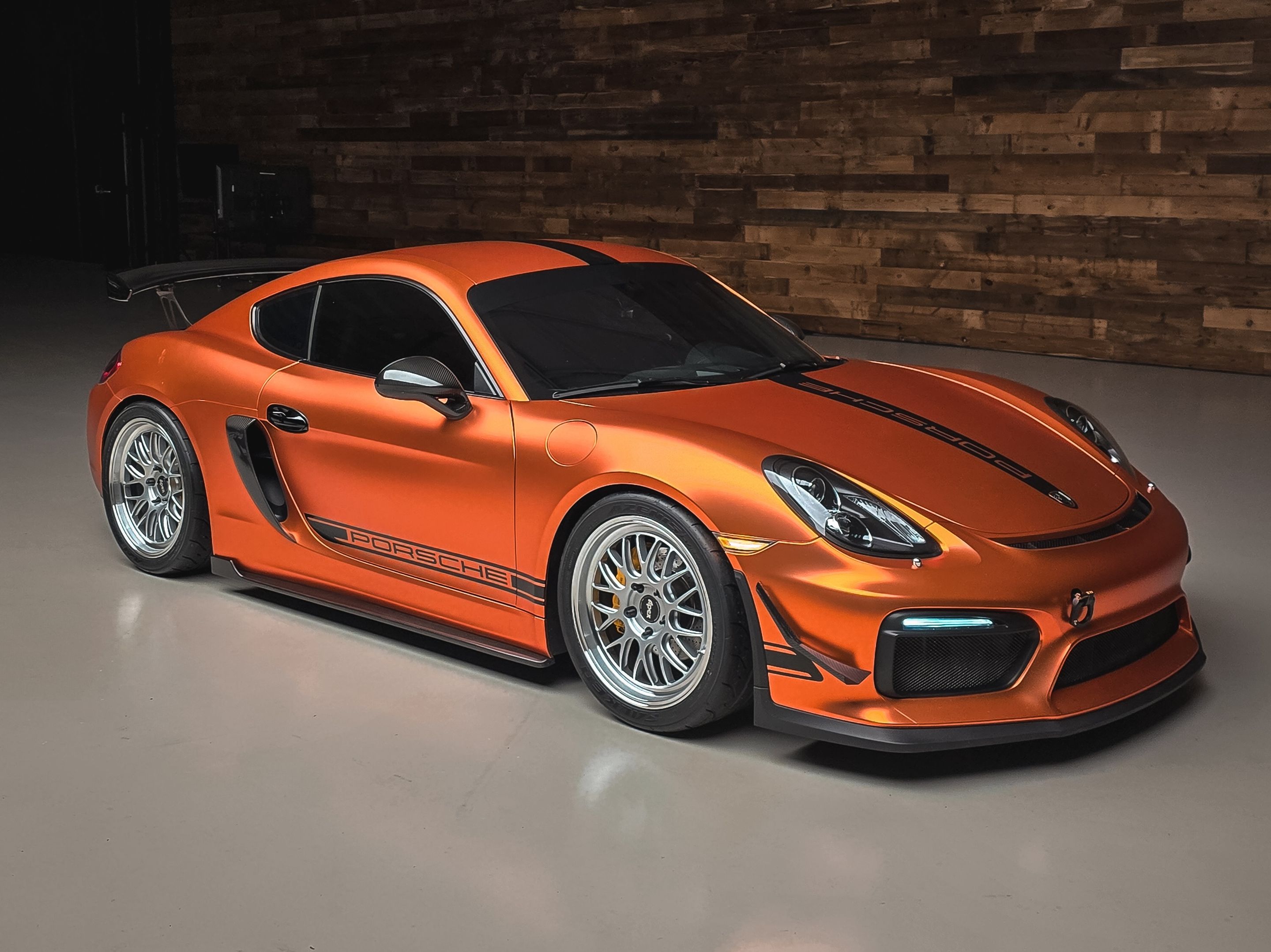 Orange Porsche 981 Cayman GT4 with 19" ML-10RT Apex wheels in Machined Lip Race Silver