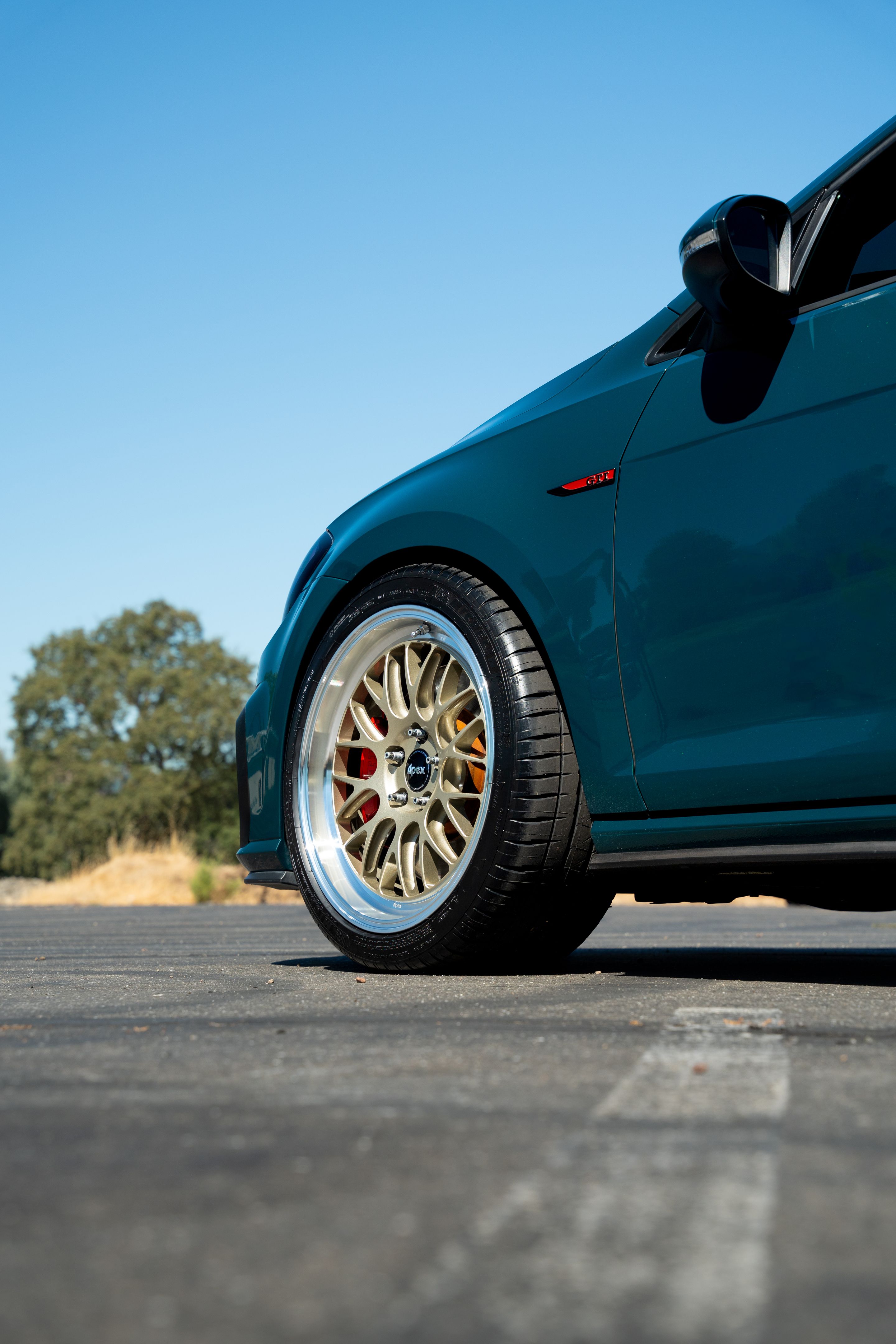 Green VW MK7 GTI with 18" ML-10RT Apex wheels in Machined Lip Gloss Motorsport Gold