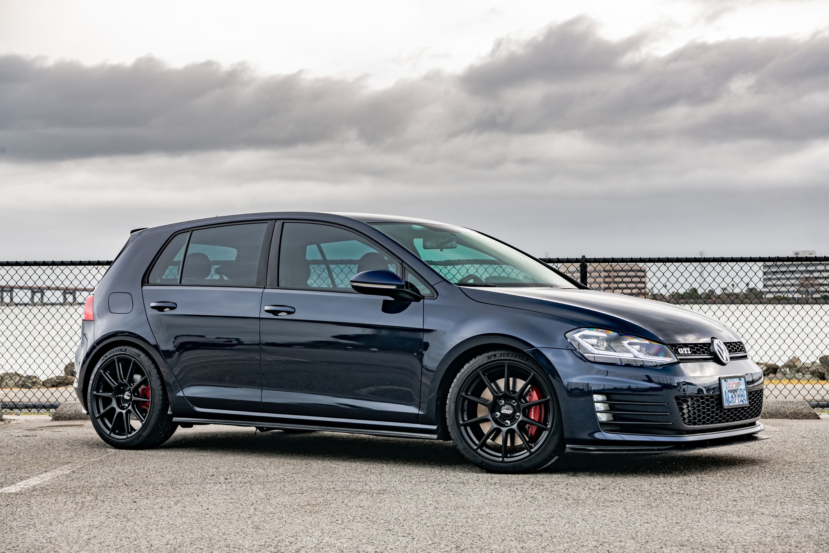 Blue VW MK7 GTI with 18" SM-10 Apex wheels in Satin Black