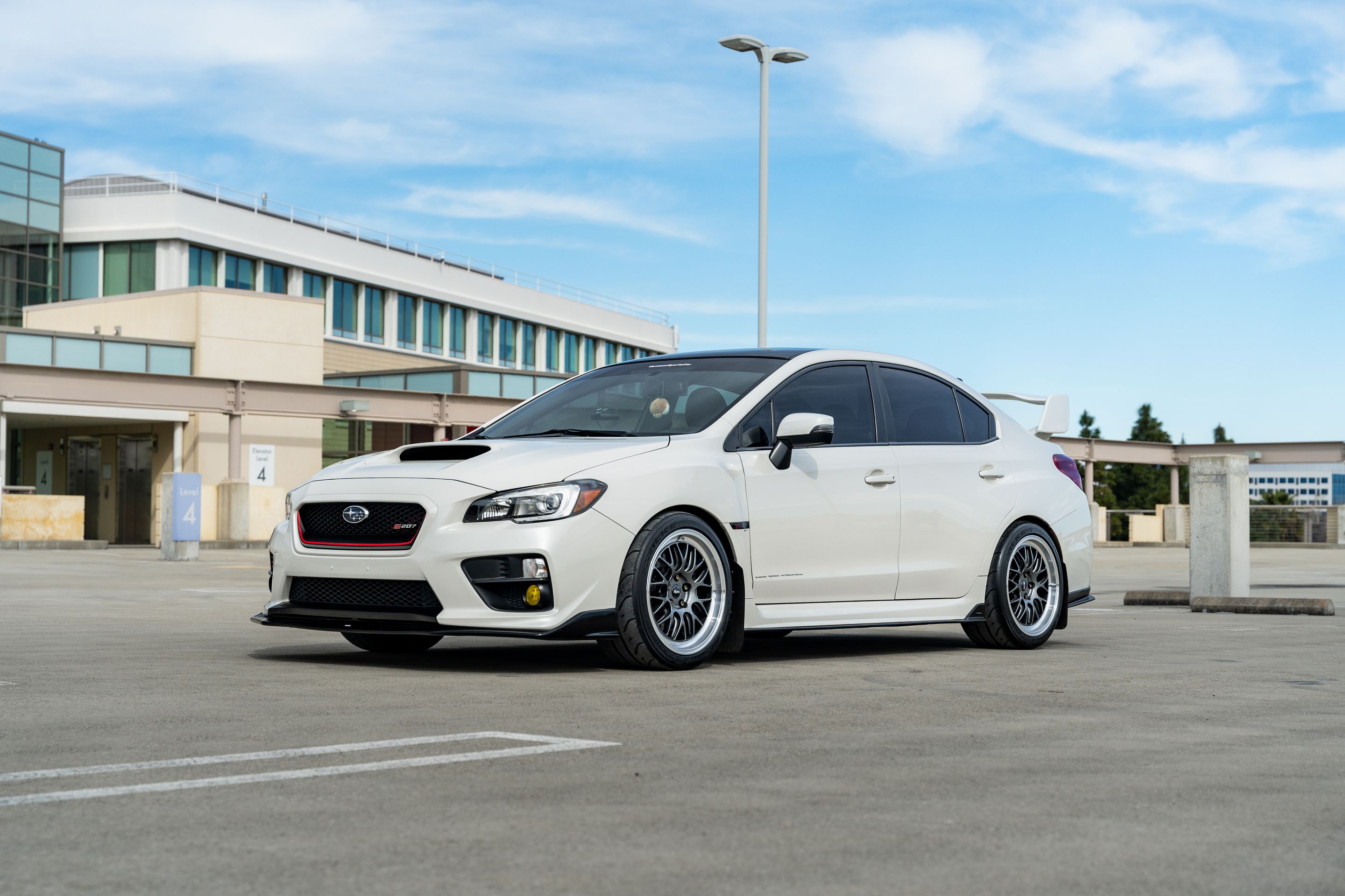 White Subaru VA WRX STI with 18" ML-10RT Apex wheels in Machined Lip Anthracite